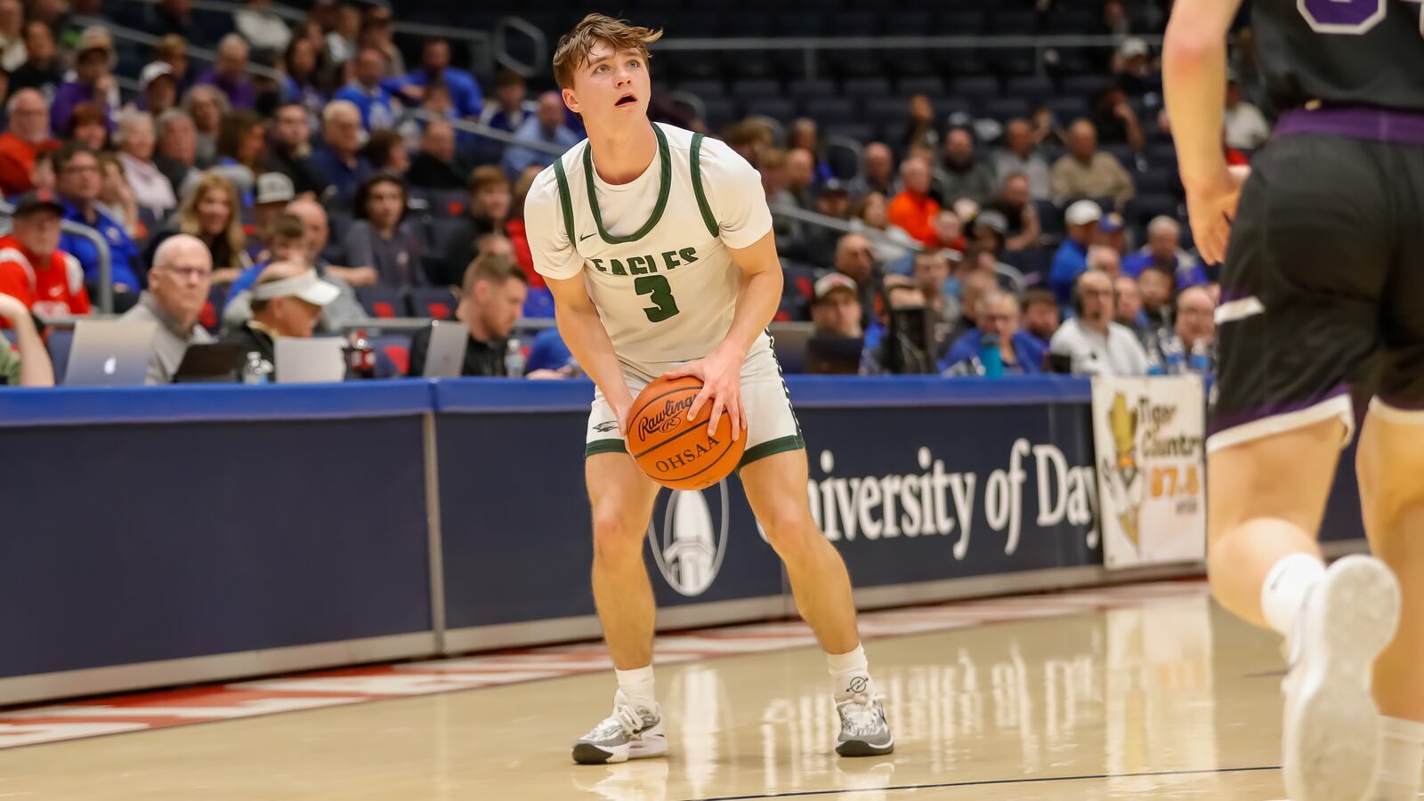 Cutline1: Troy Christian senior Parker Penrod prepares to shoot a 3-pointer during their Division IV district final game against Miami Valley Christian Academy on Saturday night at University of Dayton Arena. Penrod scored 22 points as the Eagles won 58-32. Michael Cooper/CONTRIBUTED