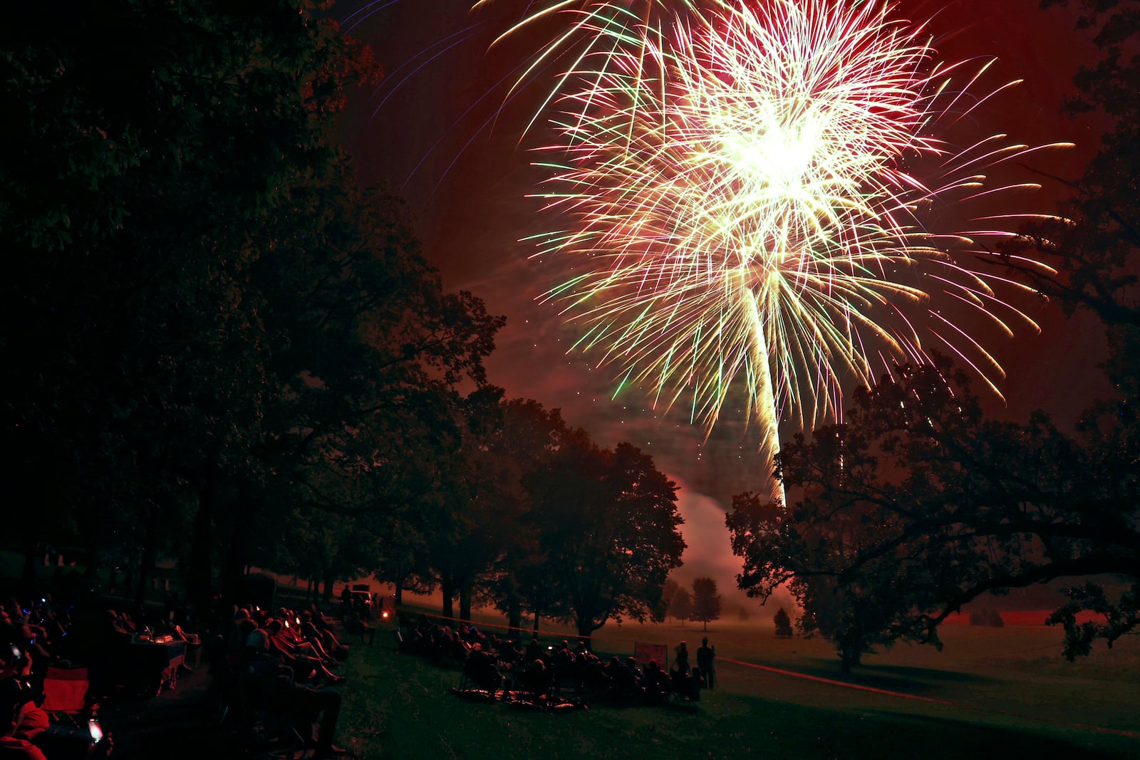 The rain stopped just in time for the Buck Creek Boom fireworks show to go on Monday, July 3, 2023 in Springfield. Spectators lined the shore of Buck Creek to watch the annual show put on by the National Trail Parks and Recreation District. BILL LACKEY/STAFF