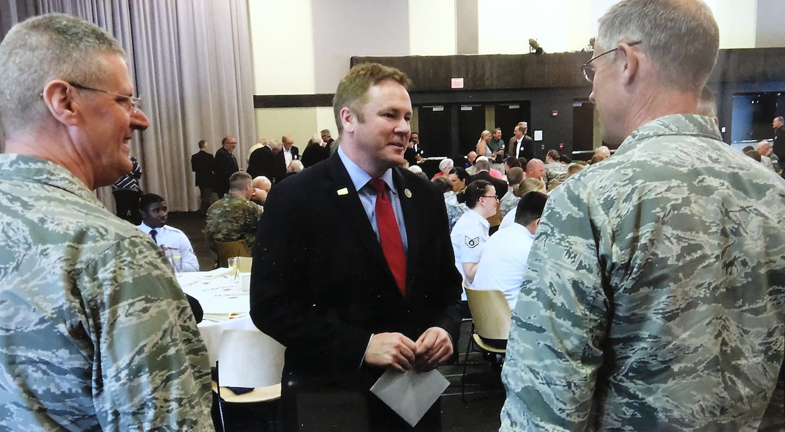 U.S. Rep. Warren Davidson talks with National Guard officials before the annual Military Appreciation Luncheon in 2017. Bill Lackey/Staff