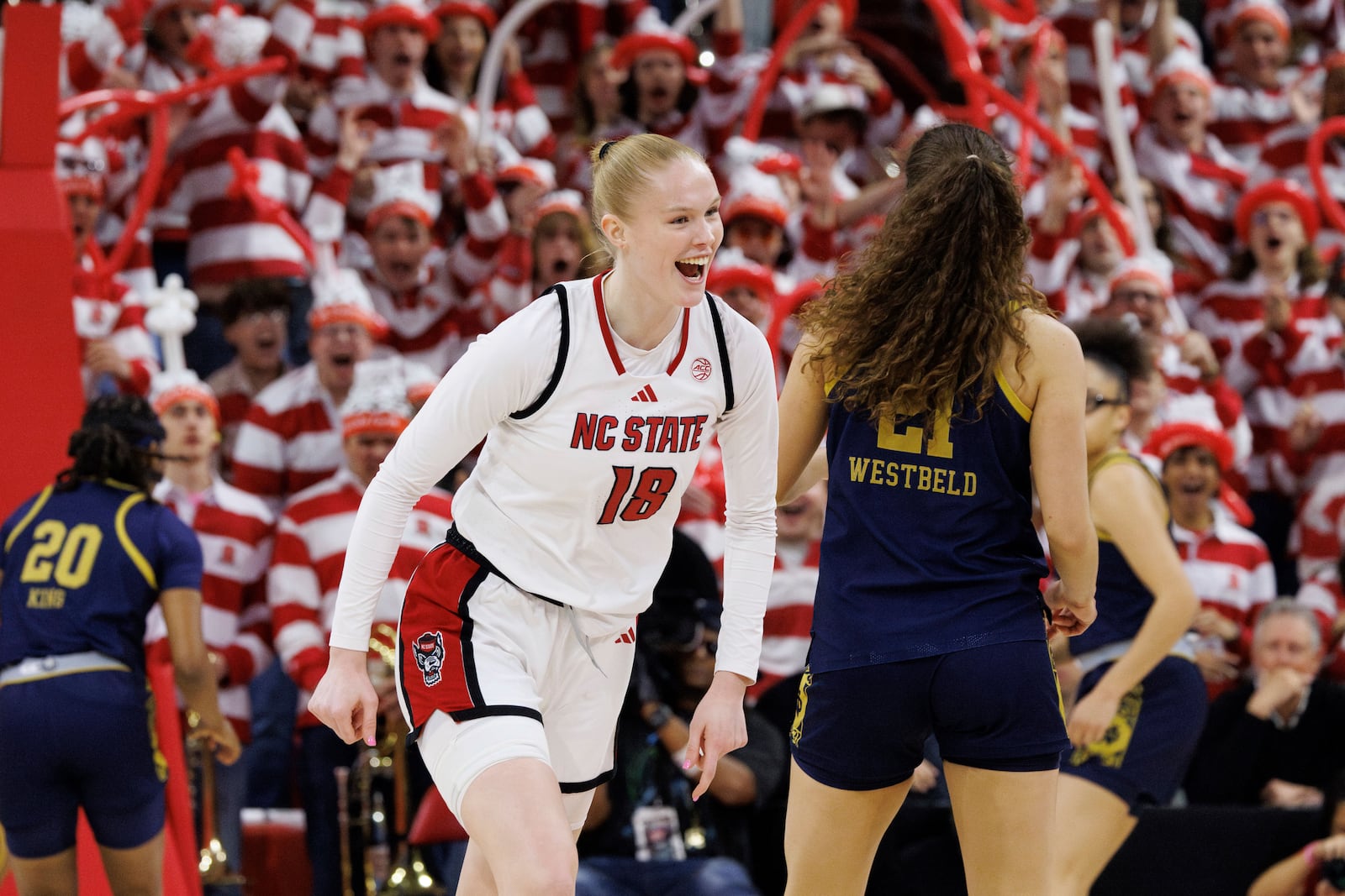 NC State's Tilda Trygger (18) reacts behind Notre Dame's Maddy Westbeld (21) after hitting a shot during the first half of an NCAA college basketball game in Raleigh, N.C., Sunday, Feb. 23, 2025. (AP Photo/Ben McKeown)