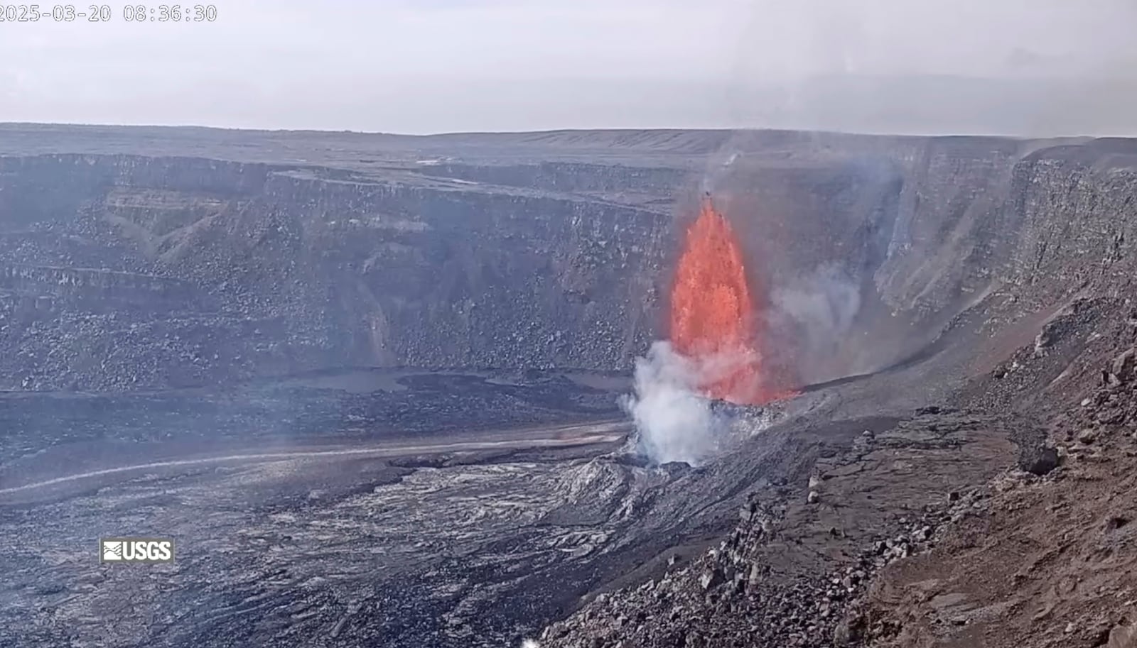 This image from webcam footage provided by the United States Geological Survey (USGS) shows lava fountains shooting up high in the latest episode of an ongoing eruption of Kilauea volcano inside Hawaii Volcanoes National Park on Thursday, March 20, 2025. (United States Geological Survey via AP)