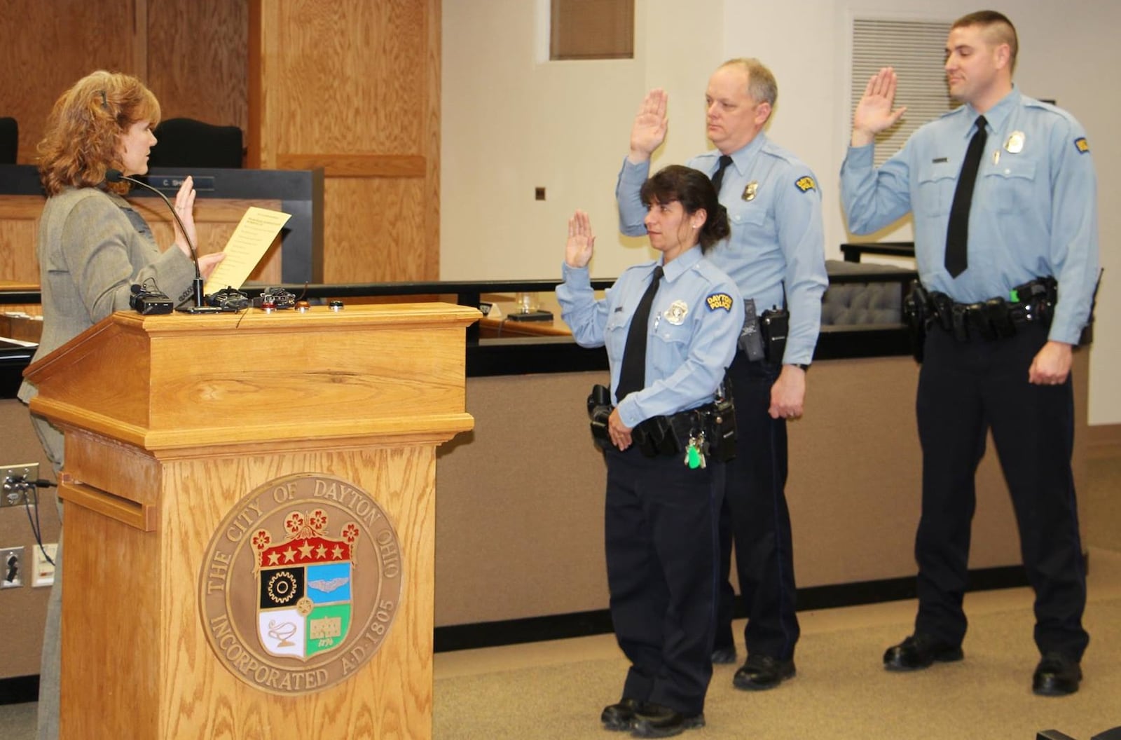 Joseph Setty, far right, is sworn in as a Dayton Police Department sergeant Feb. 25, 2016. Officers Tonina Lamanna, left and Jeffery Spires also were promoted to sergeant and shown taking the oath of office. CONTRIBUTED