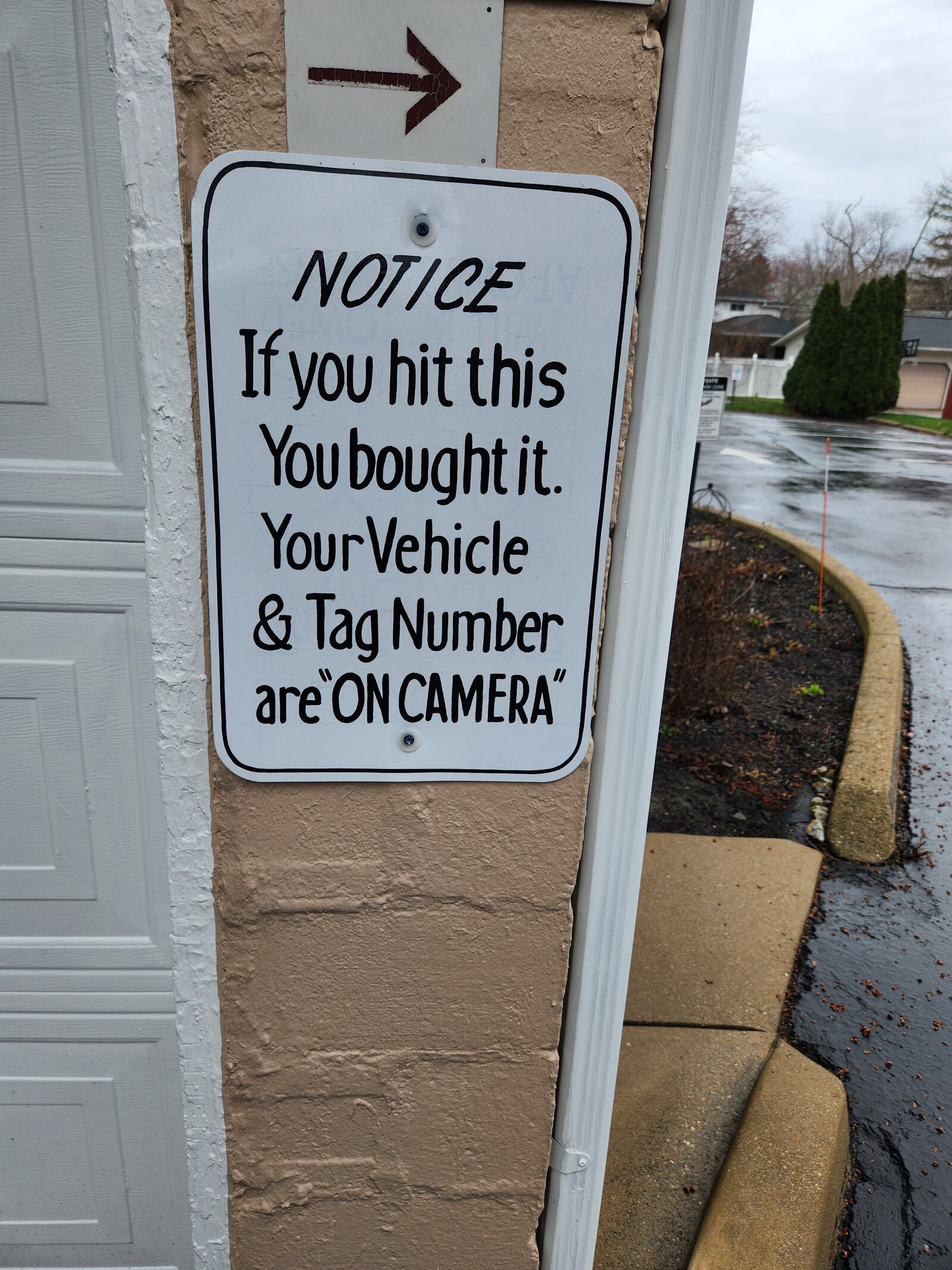 A new sign posted Platoni's garage. It reads: “If You Hit This, You Bought It. Your Vehicle and Tag Number are on Camera.” (CONTRIBUTED)