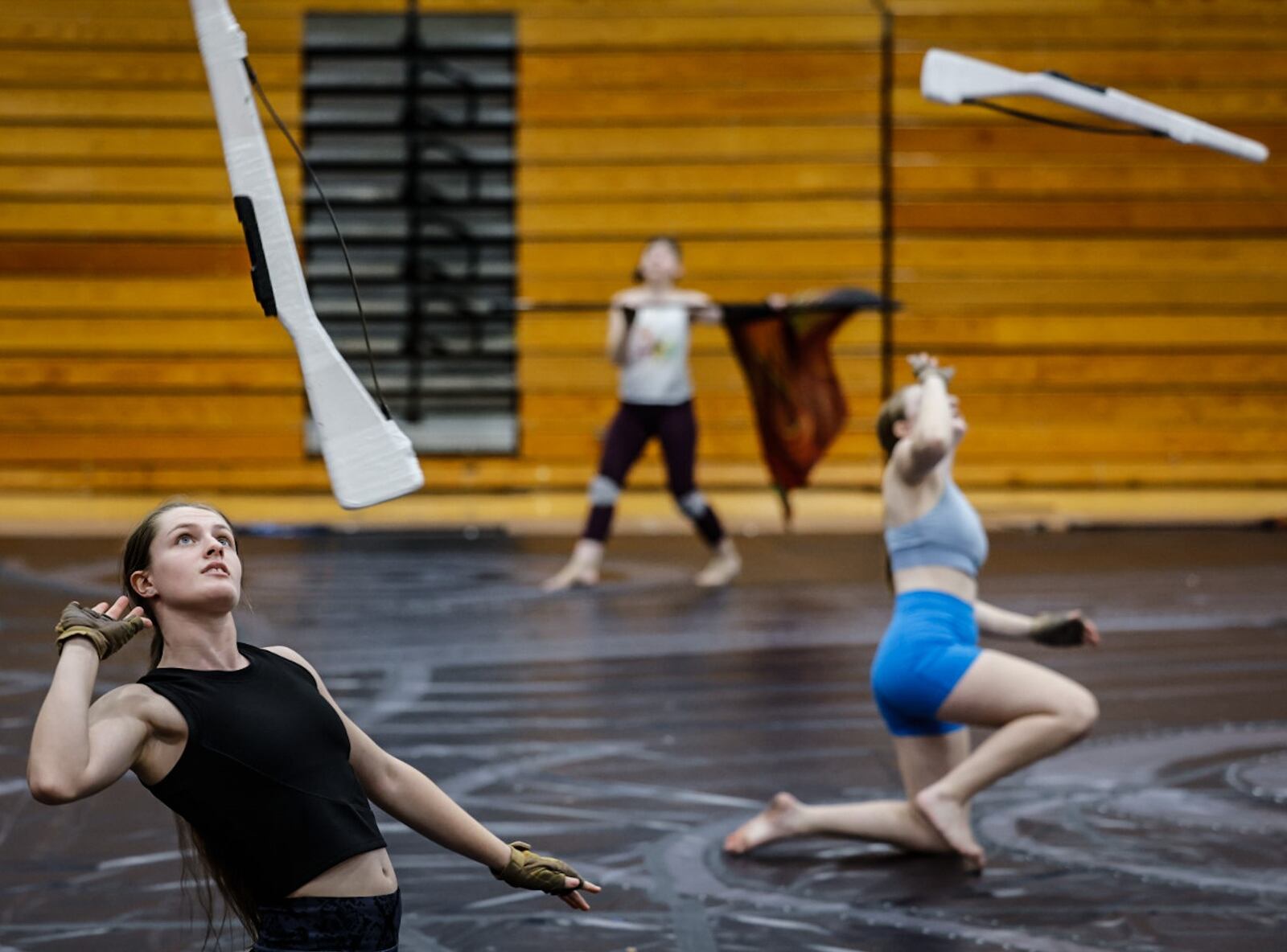 Miamisburg Color Guard team member Melissa Schlub practices with the team at Miamisburg High School Thursday April 4, 2024. The WGI Championships are set to launch Thursday, April 11, 2024. JIM NOELKER/STAFF