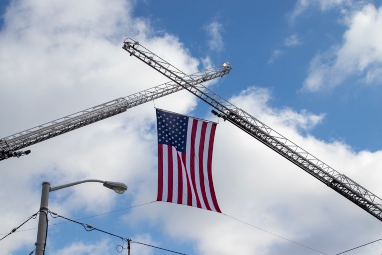 Firefighters put U.S. flag across Third Street