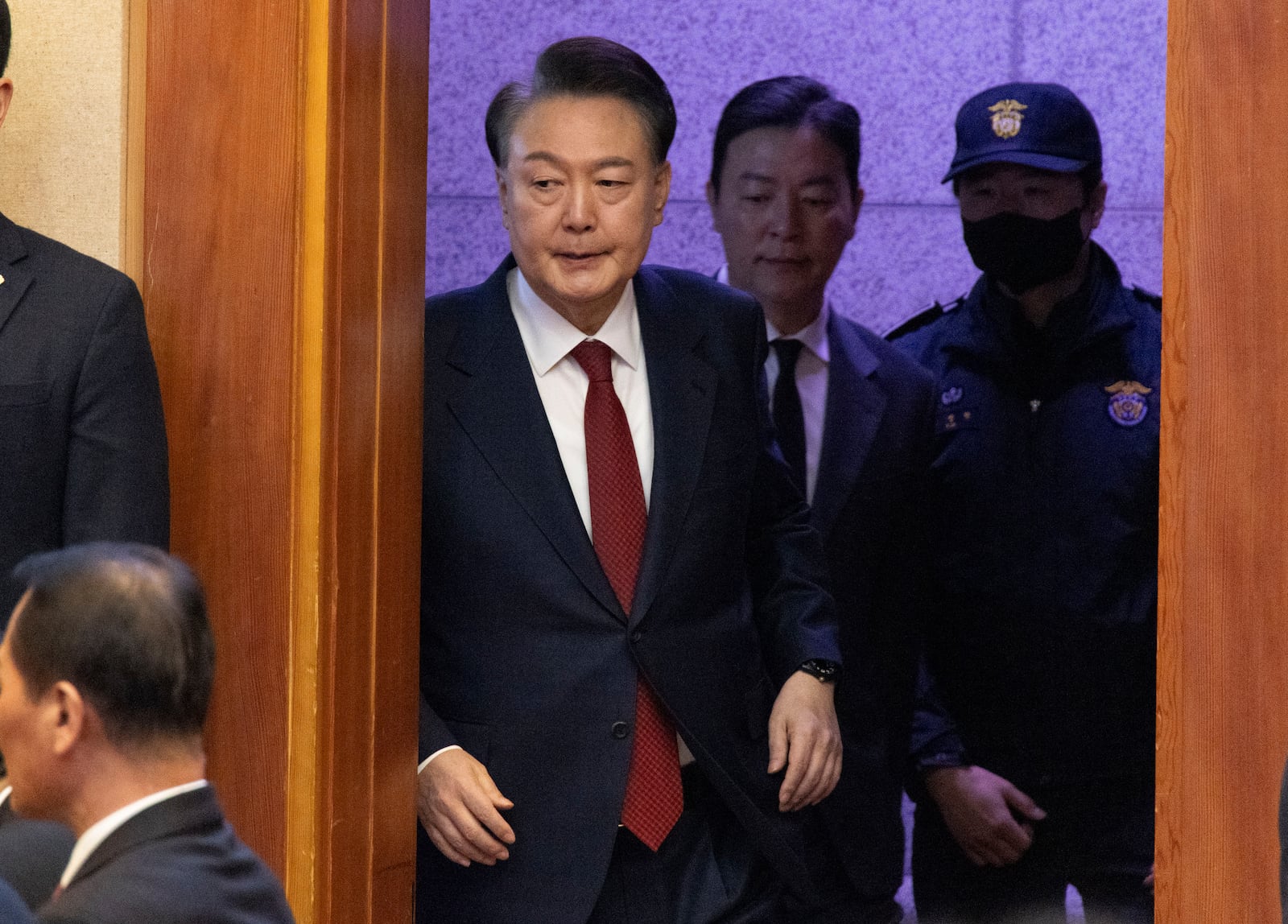 South Korea's impeached President Yoon Suk Yeol, top left, attends a hearing of his impeachment trial at the Constitutional Court in Seoul, South Korea, Thursday, Feb. 13, 2025. (Joen Heon-Kyun/Pool Photo via AP)