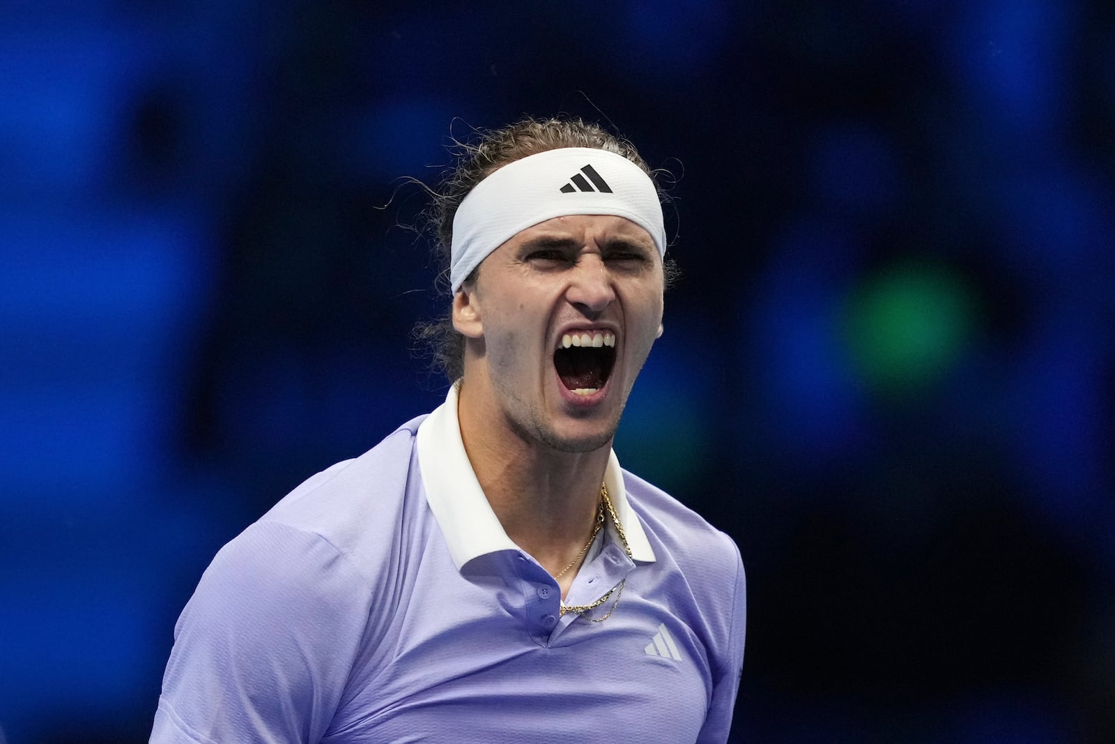 Germany's Alexander Zverev celebrates after winning the singles tennis match of the ATP World Tour Finals against Russia's Andrey Rublev, at the Inalpi Arena, in Turin, Italy, Monday, Nov. 11, 2024. (AP Photo/Antonio Calanni)