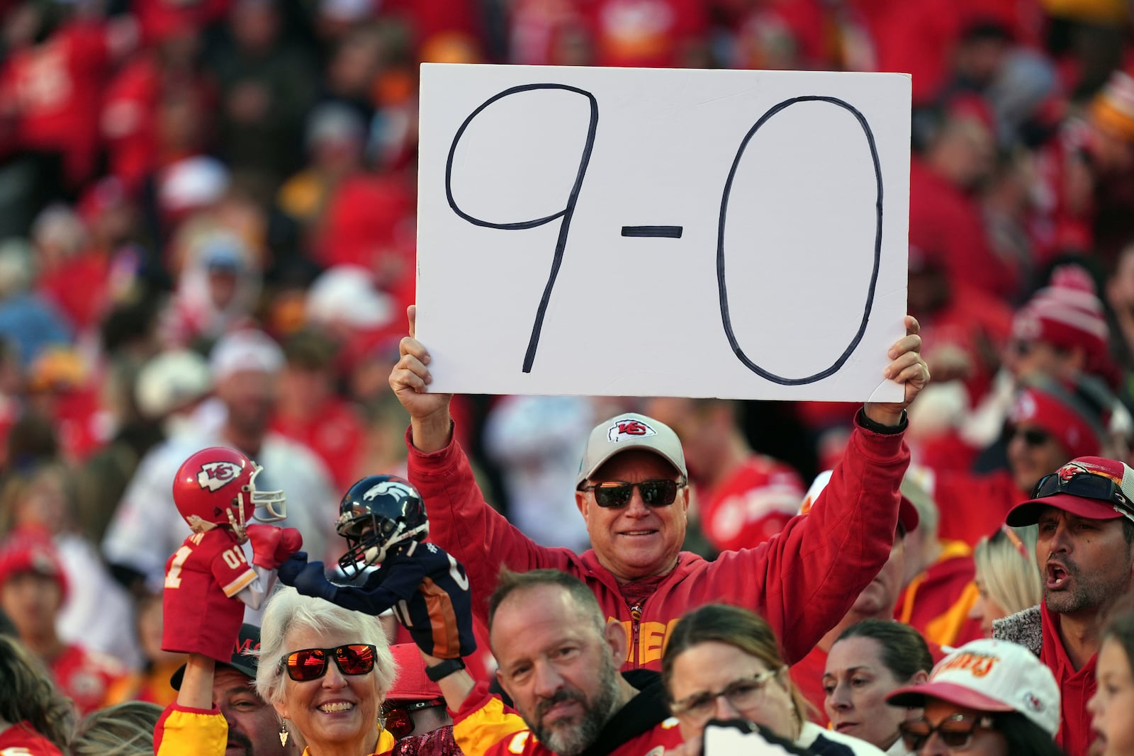 A fan holds up a sign following an NFL football game between the Kansas City Chiefs and the Denver Broncos Sunday, Nov. 10, 2024, in Kansas City, Mo. The Chiefs won 16-14. (AP Photo/Charlie Riedel)