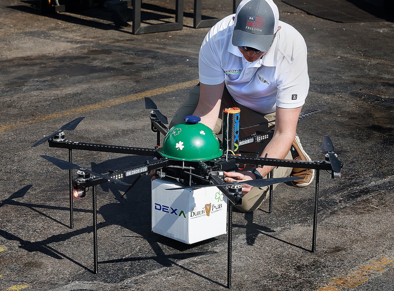 Brayton Talkington, AVP of flight operations at DEXA, prepares a drone to carry lunch from the Dublin Pub in Dayton to Mayor Jeffrey J. Mims Jr. on Thursday, March 13. MARSHALL GORBY\STAFF