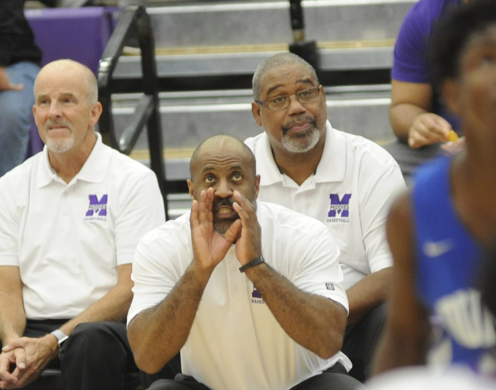 Former Dunbar head coach Pete Pullen (right) and freshman coach Jim Sliger (left) are assistants to Middletown coach Darnell Hoskins (front). Middletown defeated visiting Dunbar 60-28 in a boys high school basketball game on Tuesday, Dec. 4, 2018. MARC PENDLETON / STAFF