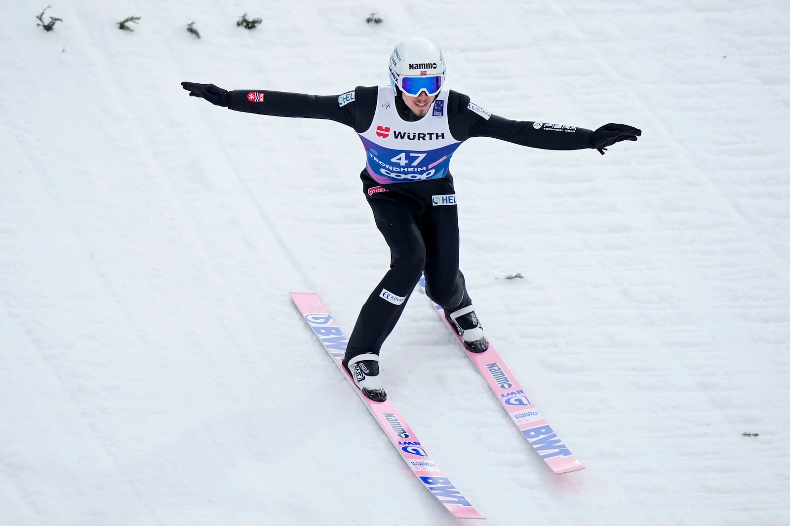 Johann Andre Forfang, of Norway, lands his first round jump of the ski jumping men's large hill individual competition at the Nordic World Ski Championships in Trondheim, Norway, Saturday, March 8, 2025. (AP Photo/Matthias Schrader)