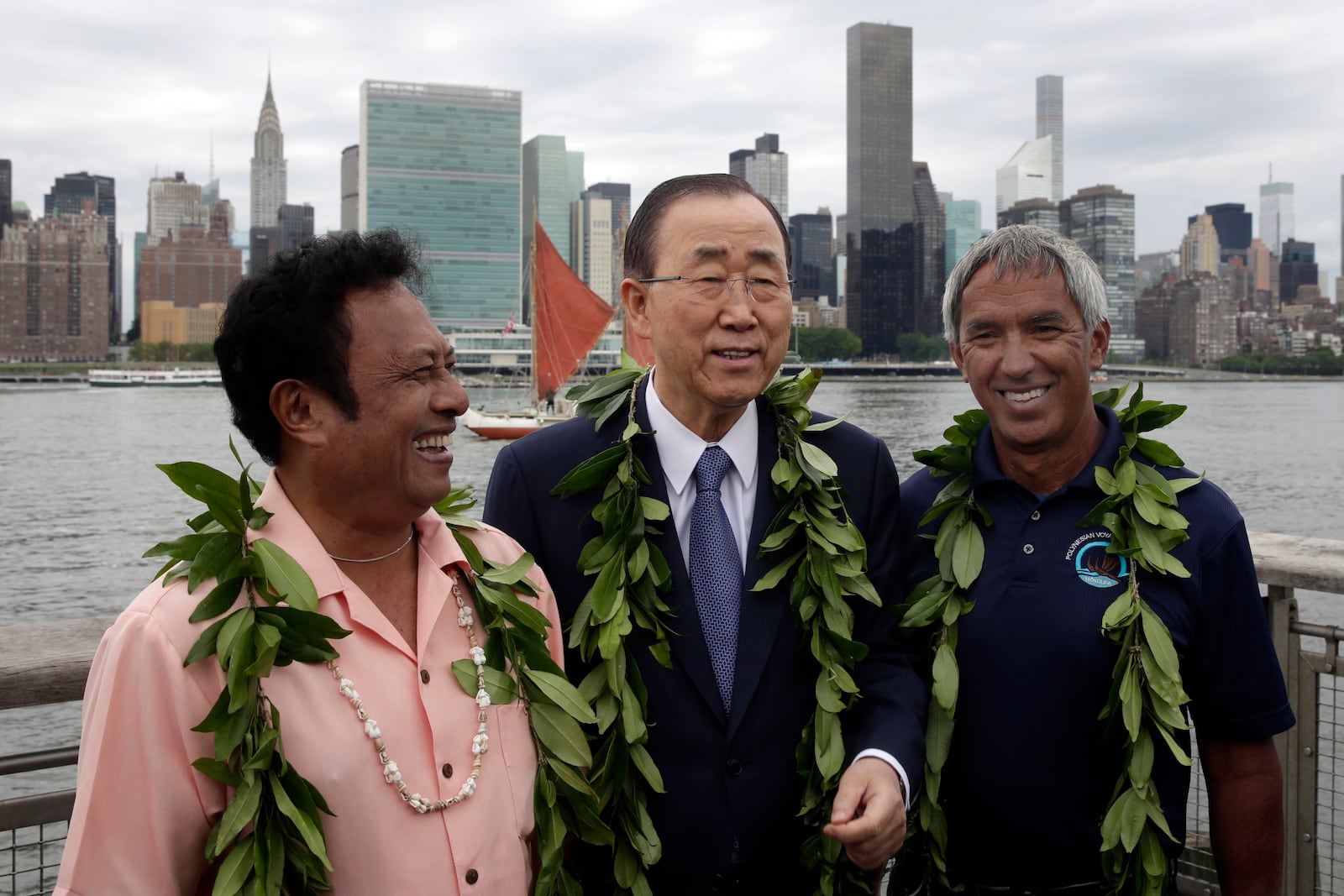 FILE - Palau President Tommy Remengesau, left, United Nations Secretary General Ban Ki-moon, center, and Nainoa Thompson, president of the Polynesian Voyaging Society, pose for photos before ceremonies for the observance of World Oceans Day, June 8, 2016, in the Queens borough of New York. (AP Photo/Richard Drew, File)