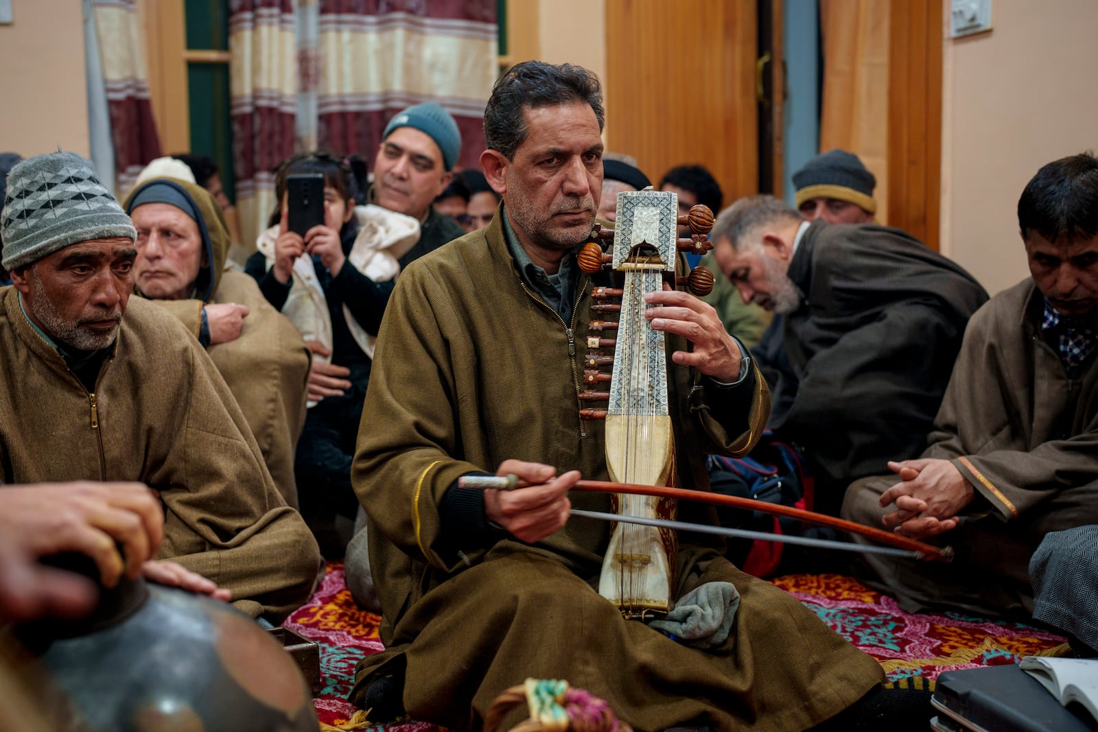 Kashmiri musician plays the sarangi during a Sufi music gathering in the outskirts of Srinagar, Indian controlled Kashmir, Thursday, Feb. 13, 2025. (AP Photo/Dar Yasin)