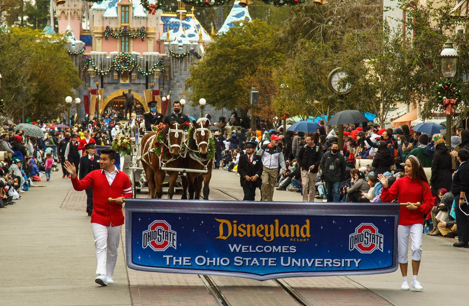 The head football coaches and select players from The Ohio State University Buckeyes and the Utah Utes appear in a festive cavalcade at Disneyland Park in Anaheim, Calif., Dec. 27, 2021. The teams made their first stop on the way to the 2022 Rose Bowl Game presented by Capital One Venture X in Pasadena, Calif., with a traditional visit to the Disneyland Resort. (Christian Thompson/Disneyland Resort)