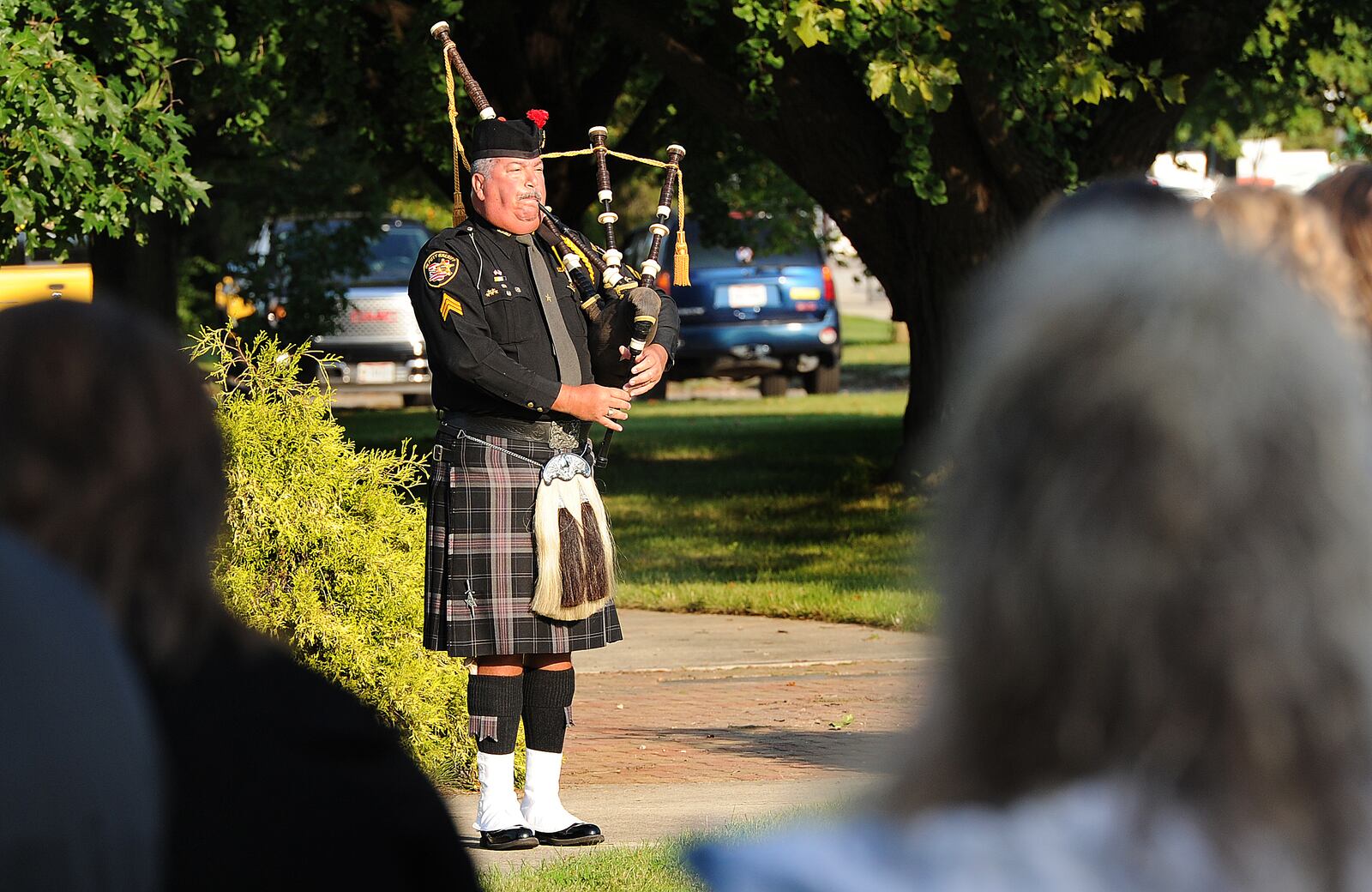 Retired Montgomery County Sheriff's Office Sgt. Del Braund played  "Amazing Grace" on the bagpipes during the Fairborn  20th annual 9/11 Memorial Ceremony, Saturday,  Sept. 11 on the front lawn of Calamityville, the National Center for Medical Readiness. MARSHALL GORBY/STAFF
