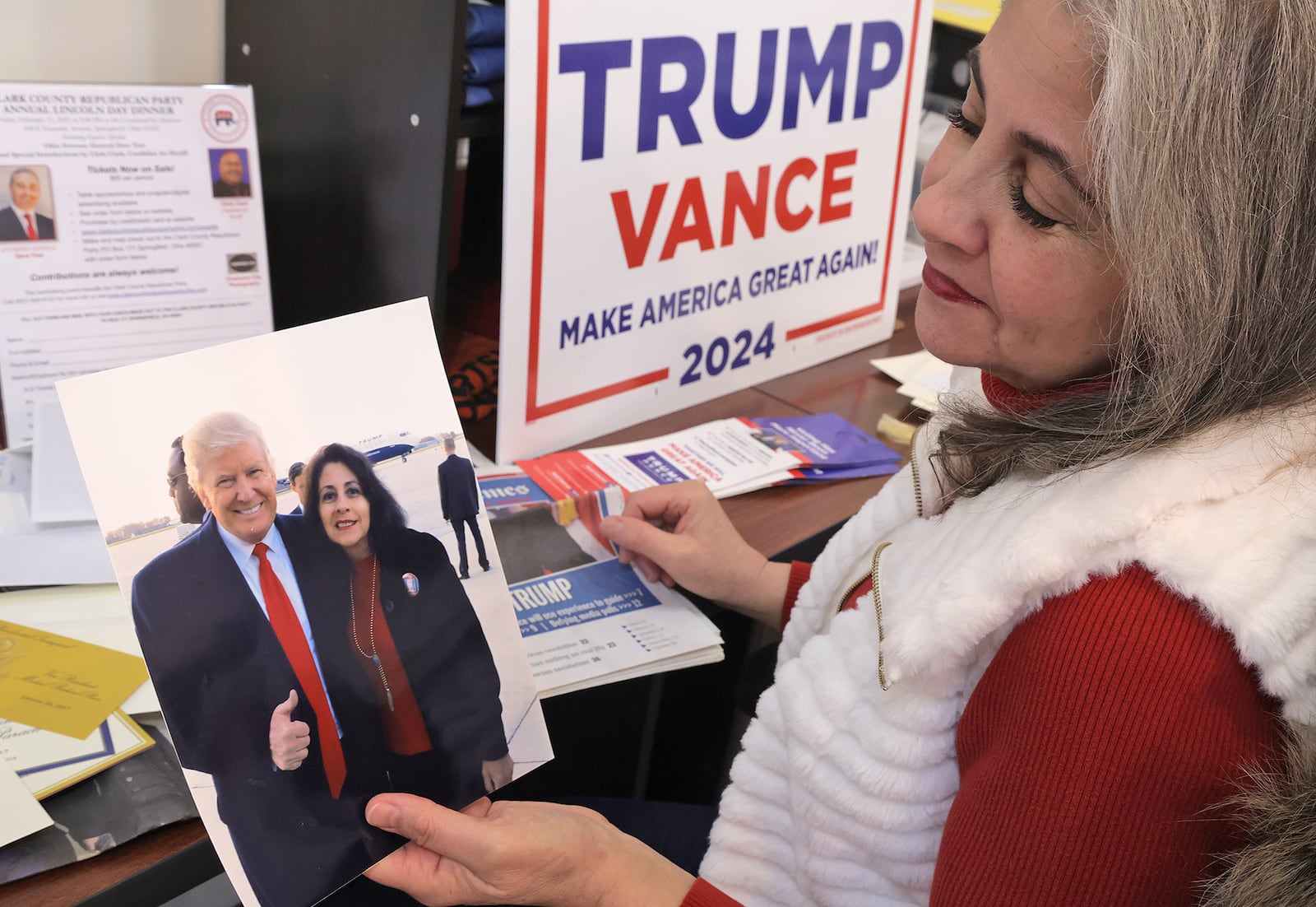 Laura Rosenberger, chairperson for the Clark County Republican Party, looks over her mementos from the last Donald Trump inauguration which she attended Wednesday, Jan. 15, 2025. Rosenberger is attending the inauguration on Jan. 20th. BILL LACKEY/STAFF