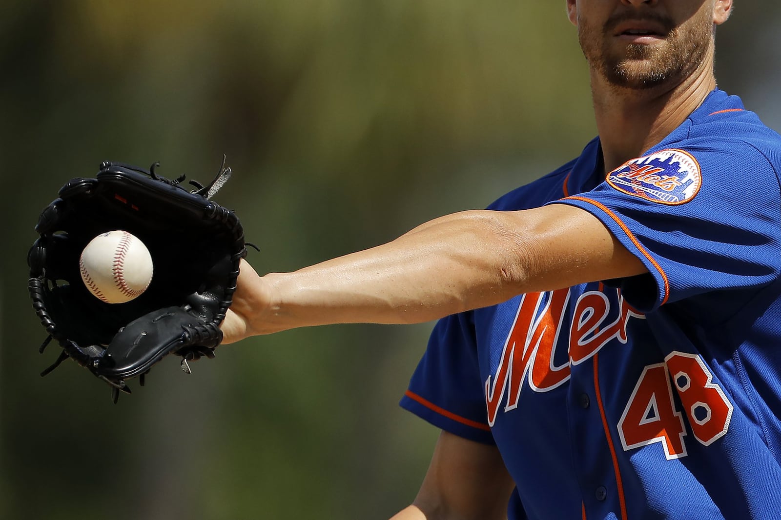 Neal Gittleman’s father introduced him to baseball, and the New York Mets, when he was a boy. Pictured is Mets pitcher Jacob deGrom shown warming up during spring training earlier this month. ASSOCIATED PRESS/JULIO CORTEZ