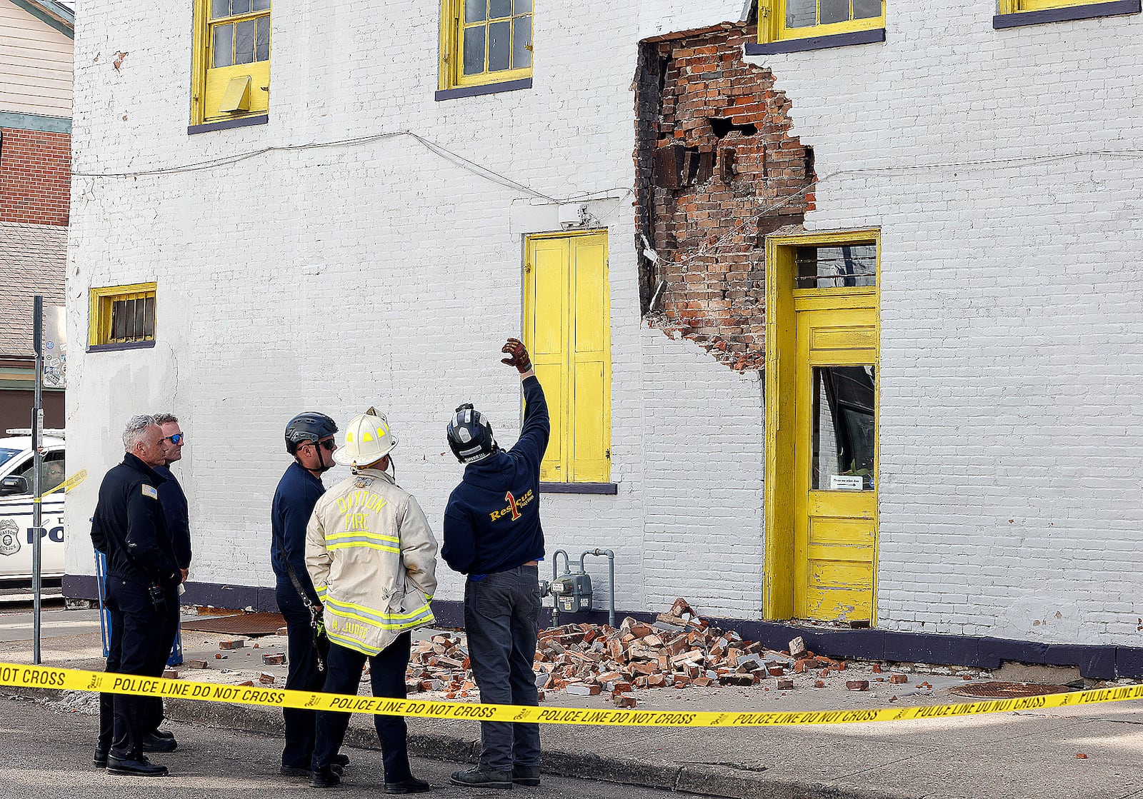 The Dayton Fire Department investigates a partial building collapse on Jackson Street Monday, March 24, 2025 in the Oregon District. MARSHALL GORBY\STAFF