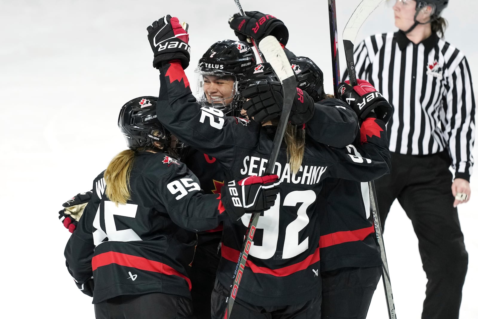 Members of Team Canada celebrate a goal against the United States during the second period of a Rivalry Series hockey game in Summerside, Prince Edward Island, Canada, Saturday, Feb. 8, 2025. (Darren Calabrese/The Canadian Press via AP)