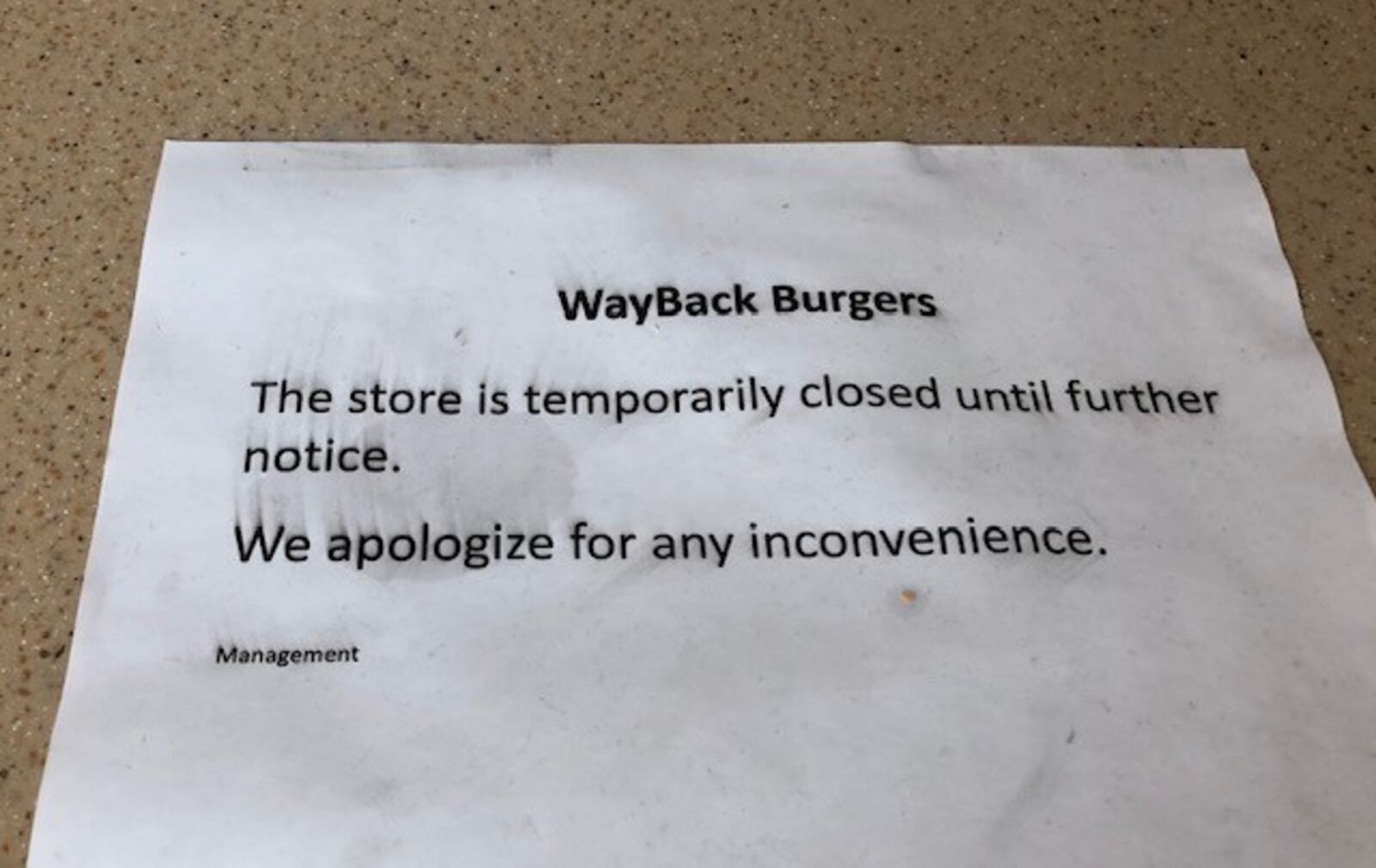 The Wayback Burgers restaurant in the Mall at Fairfield Commons Food Court is closed "until further notice" because its franchise owner returned to his native Bahamas, a spokeswoman for the restaurant chain said. This sign is taped to the restaurant's counter.