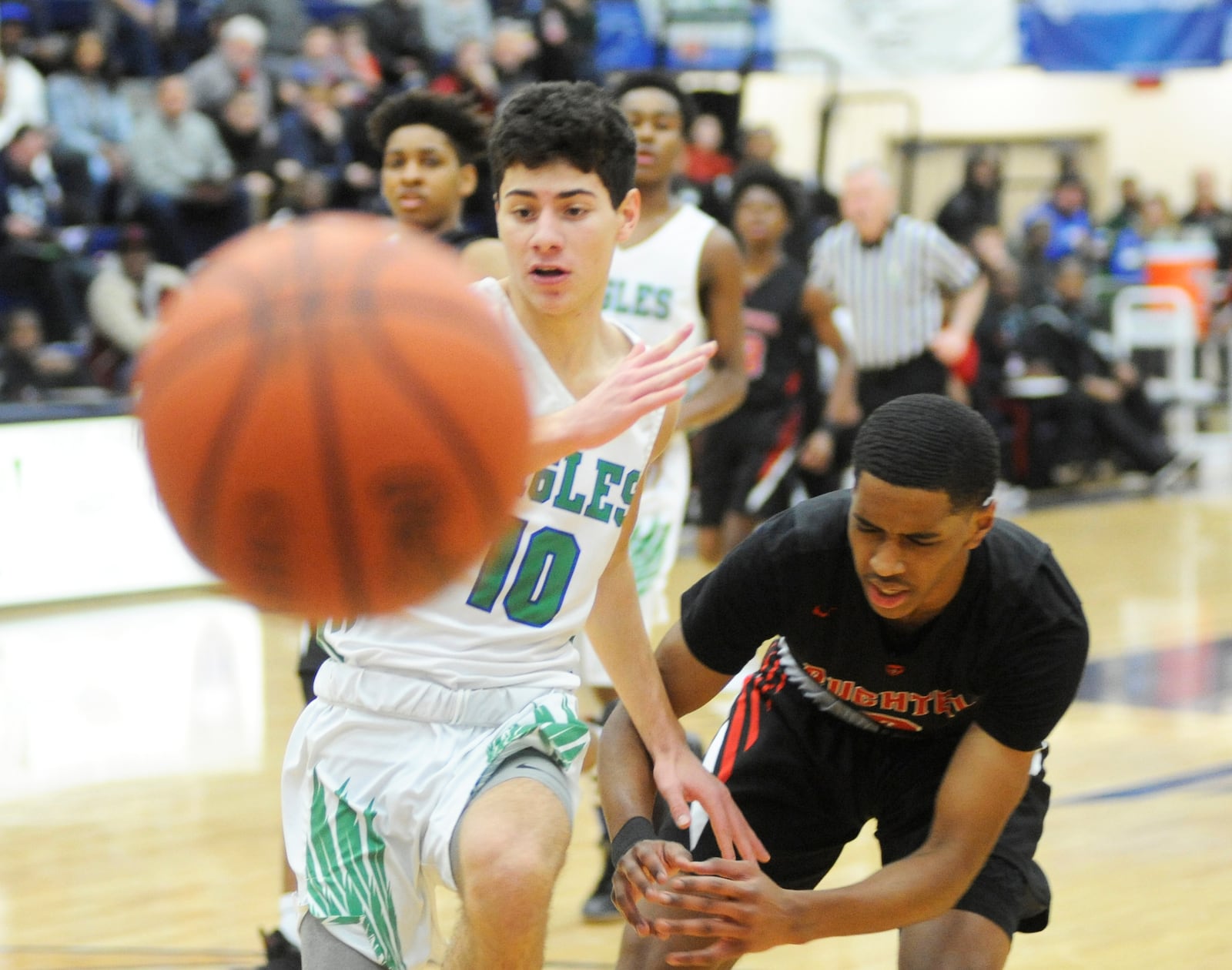 CJ’s John Nauseef (left) goes for a loose ball. MARC PENDLETON / STAFF