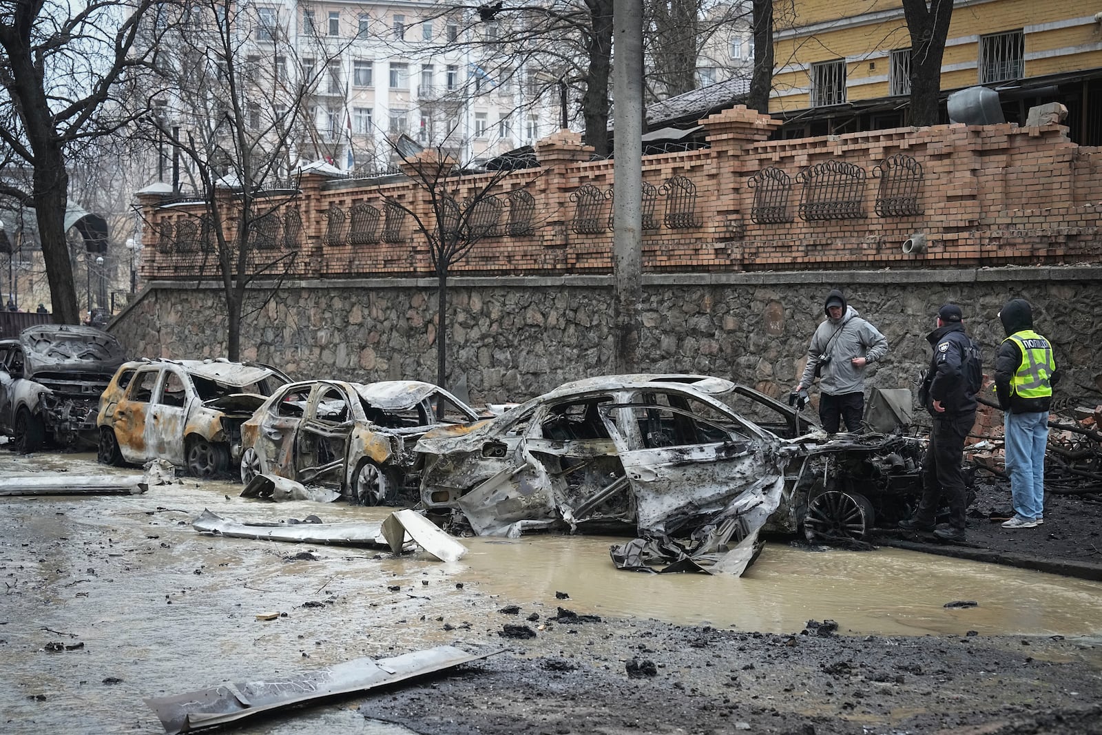 Police officers collect evidence following recent Russian attacks in Kyiv, Ukraine, Friday, Dec. 20, 2024. (AP Photo/Efrem Lukatsky)