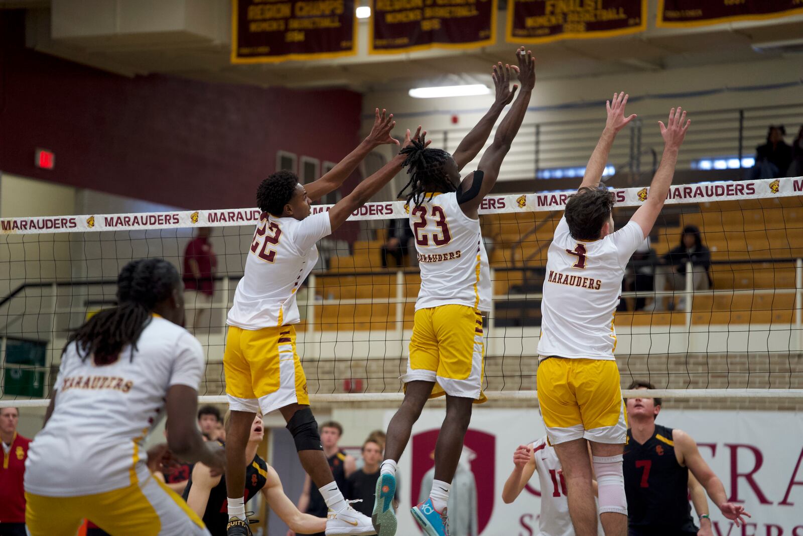 Central State's Preston Smith (22) , Alain Tamo-Noche (23) and Adam Sheppard, a Fairmont High School product, go up for a block attempt during Wednesday night's match vs. USC at Central State. Malik White/Central State Athletics