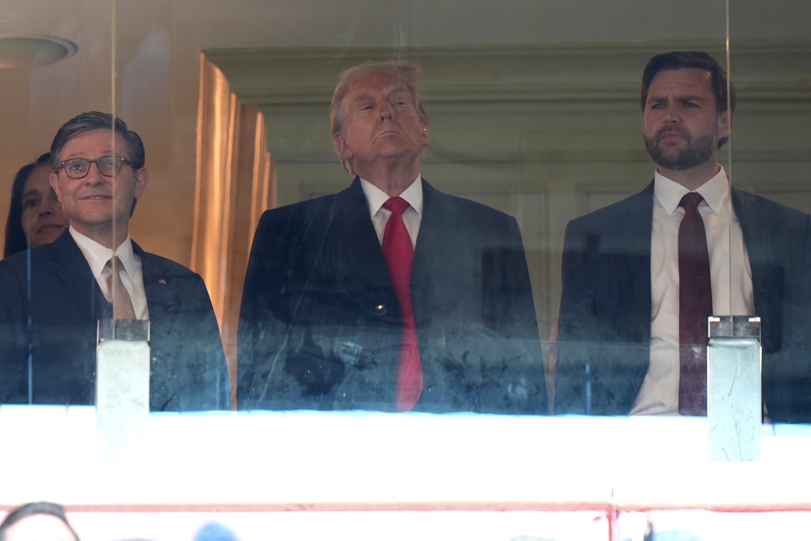 House Speaker Mike Johnson, from left, President-elect Donald Trump and Vice President-elect JD Vance attend the NCAA college football game between Army and Navy at Northwest Stadium in Landover, Md., Saturday, Dec. 14, 2024. (AP Photo/Stephanie Scarbrough)