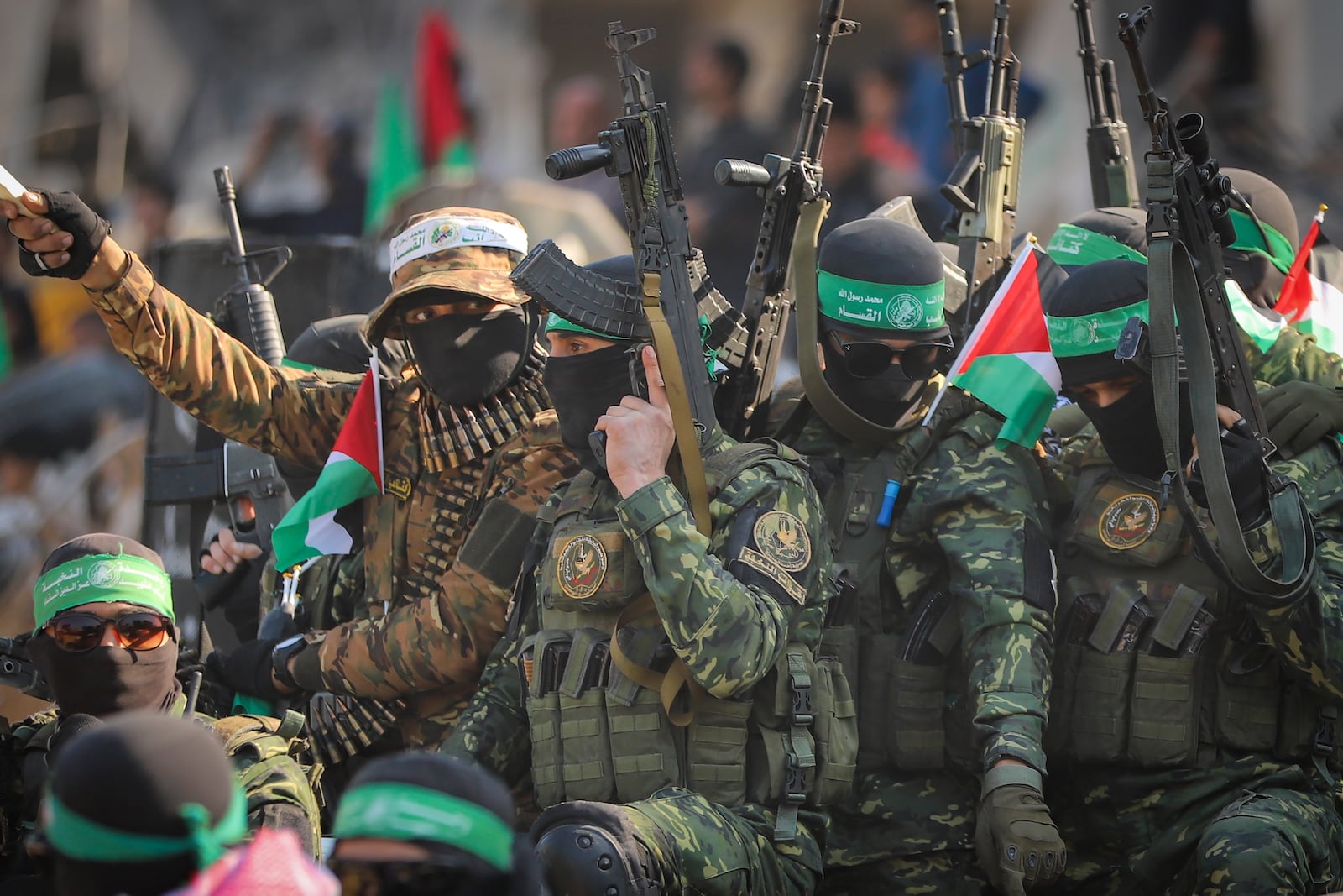 Hamas fighters arrive in a pick-up truck to the site of the hand over of hostage Agam Beger to the Red Cross at the Jabalya refugee camp in Gaza City, Thursday Jan. 30, 2025.(AP Photo/Mohammed Hajjar)