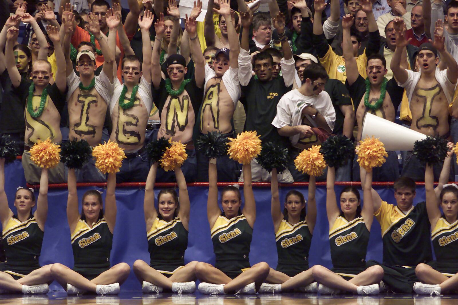 Siena cheerleaders and fans cheer on the Saints as they played Alcorn State in the NCAA basketball tournament's "play-in" game at UD Arena in 2001.