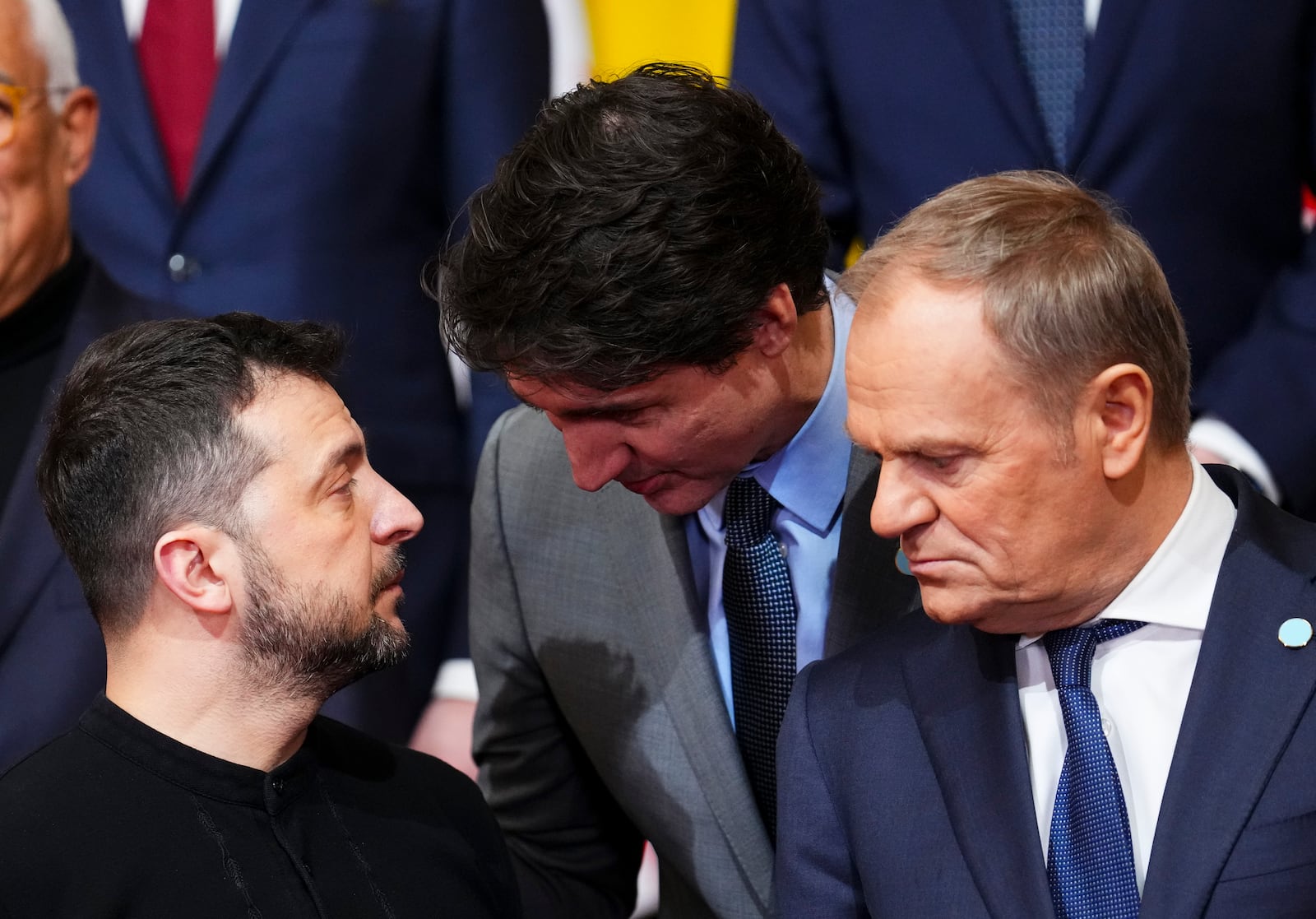 Canada Prime Minister Justin Trudeau, center, Ukraine's President Volodymyr Zelenskyy, left, and Polish Prime Minister Donald Tusk take part in a group photo during the Securing our Future Summit on Ukraine and European security at Lancaster House in London, Sunday, March 2, 2025. (Sean Kilpatrick/The Canadian Press via AP)