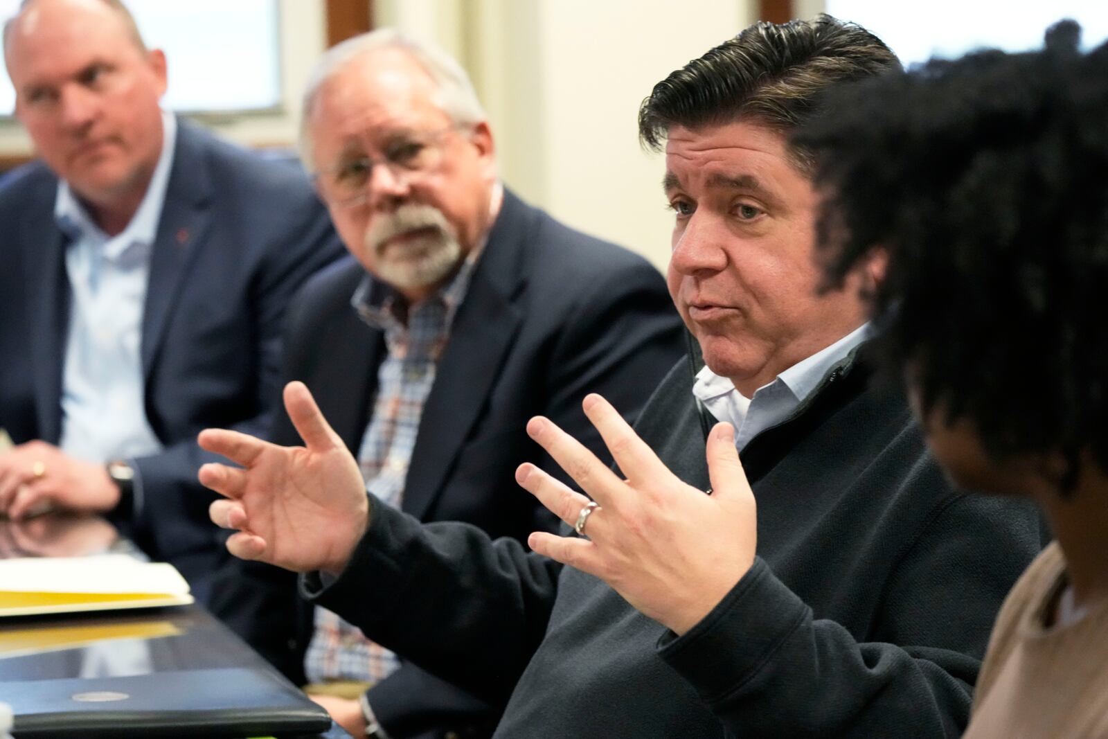 Illinois Gov. JB Pritzker talks during a visit to Soybean Innovation Lab at the University of Illinois, which is impacted by DOGE funding cuts, in Urbana, Ill., Wednesday, March 19, 2025. (AP Photo/Nam Y. Huh)