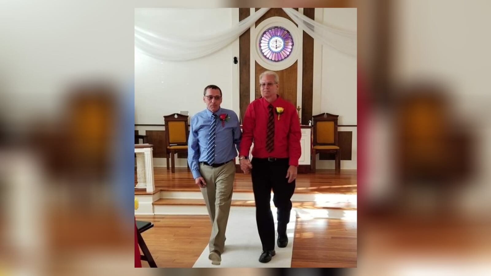 Raymond Russell, left, and Dale Carter walk down the aisle following their marriage ceremony in October 2018 in Florida.