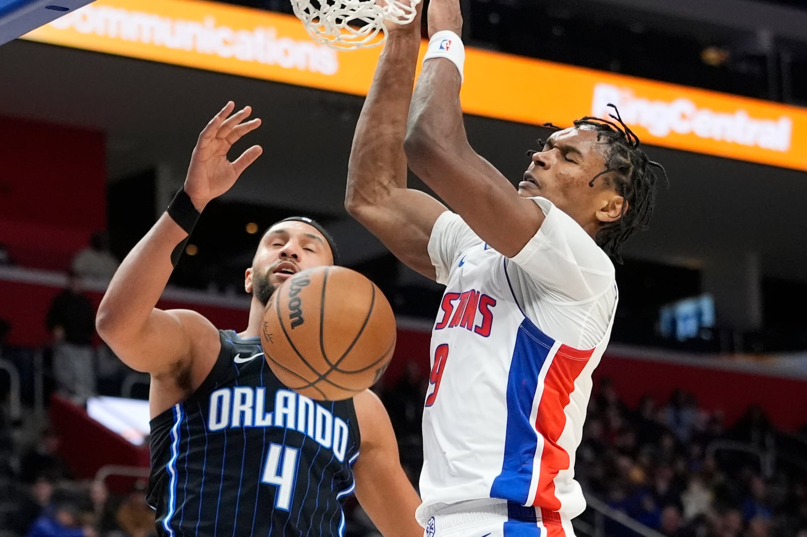 Detroit Pistons forward Ausar Thompson (9) dunks as Orlando Magic guard Jalen Suggs (4) defends during the first half of an NBA basketball game, Wednesday, Jan. 1, 2025, in Detroit. (AP Photo/Carlos Osorio)