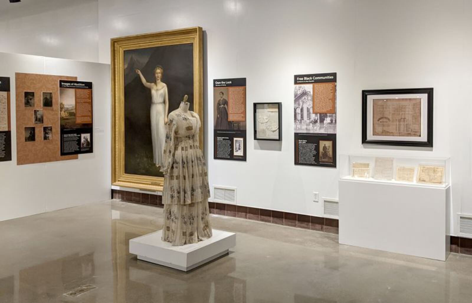 The "Rhythm of Revolution" exhibit at The National Afro-American Museum & Cultural Center shows a map of Africa from the 1700s the way it was envisioned by European colonists. The display features a wedding dress made for Remithy Ward Hatcher, a Cincinnati woman who had been enslaved in the south. CONTRIBUTED