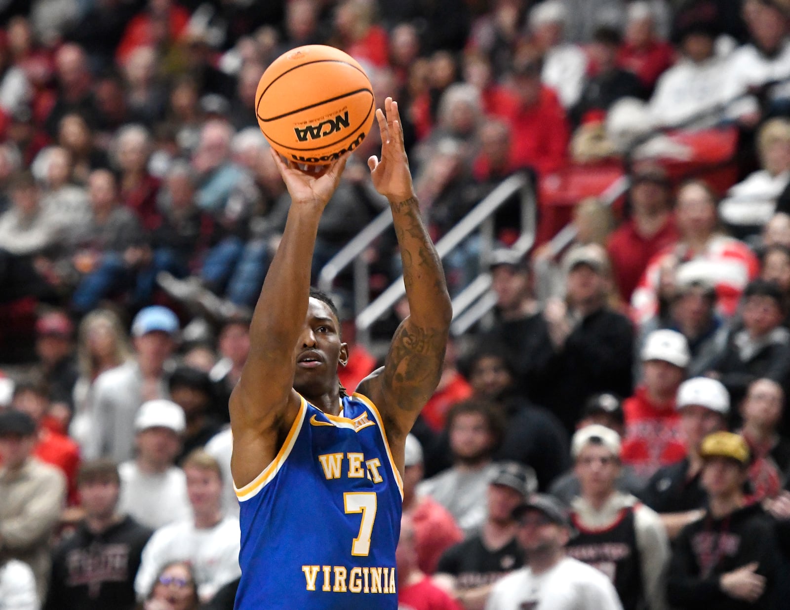 West Virginia guard Javon Small (7) shoots during the second half of an NCAA college basketball game against Texas Tech, Saturday, Feb. 22, 2025, in Lubbock, Texas. (AP Photo/Annie Rice)