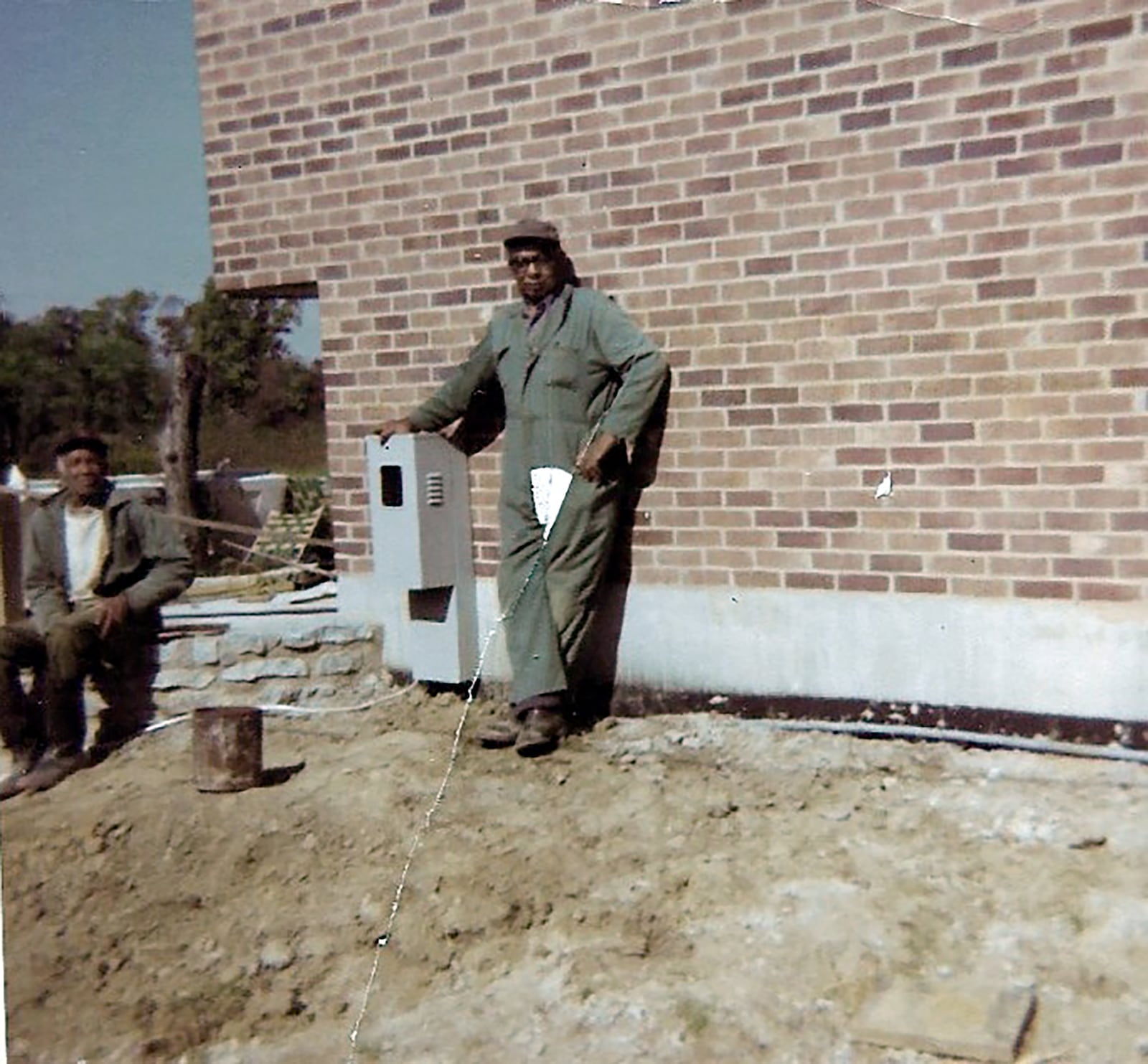 Johnson's father Wilbur Kenneth Johnson with one of his employees on a job in the 1970's. He started his own business after World War II.