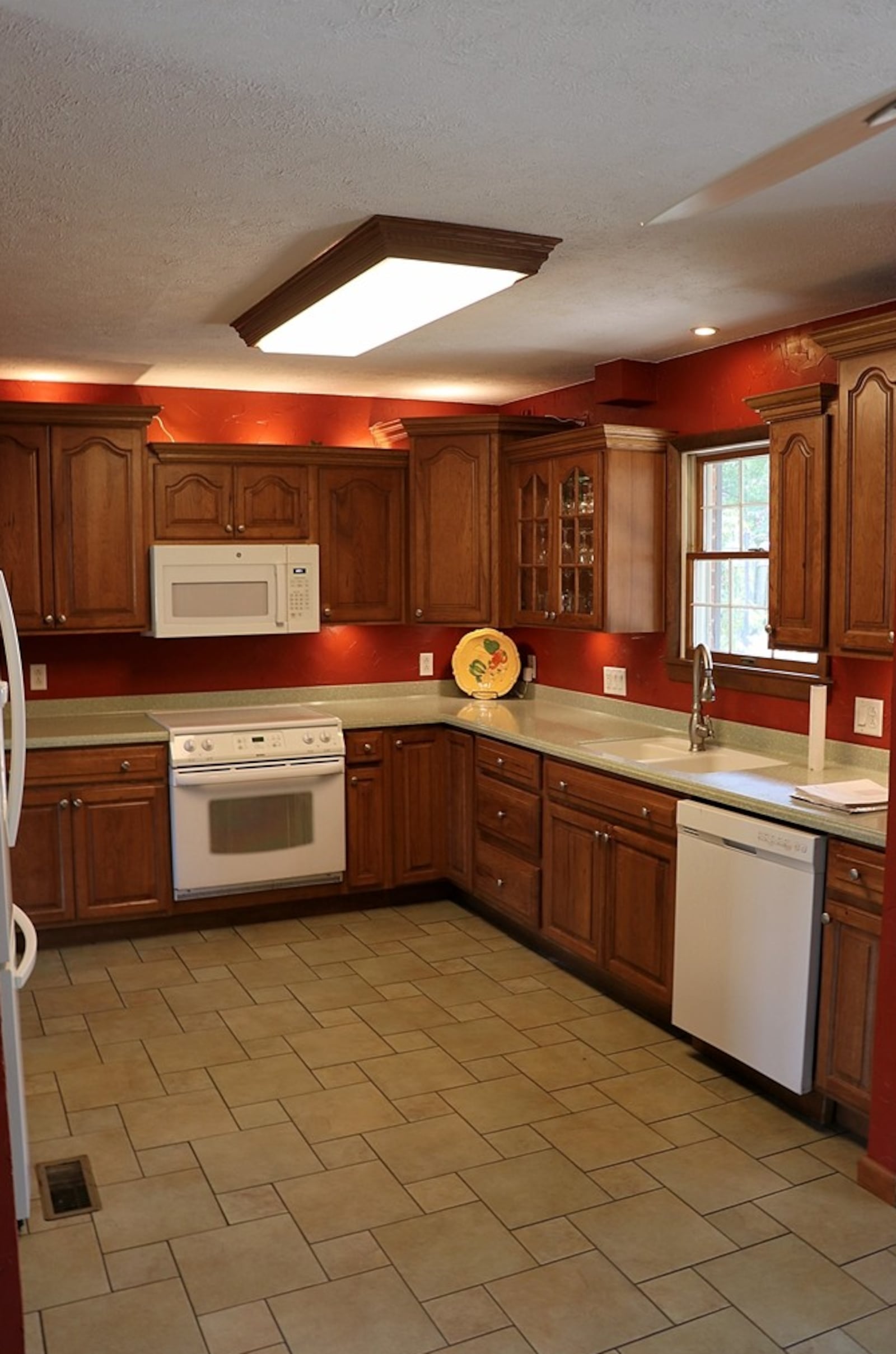 Completing the circular floor plan on the main level of a home for sale at 305 Mound St. in Brookville, the kitchen is accessible from the foyer hallway and blends into the dining area which is open to the living room. CONTRIBUTED