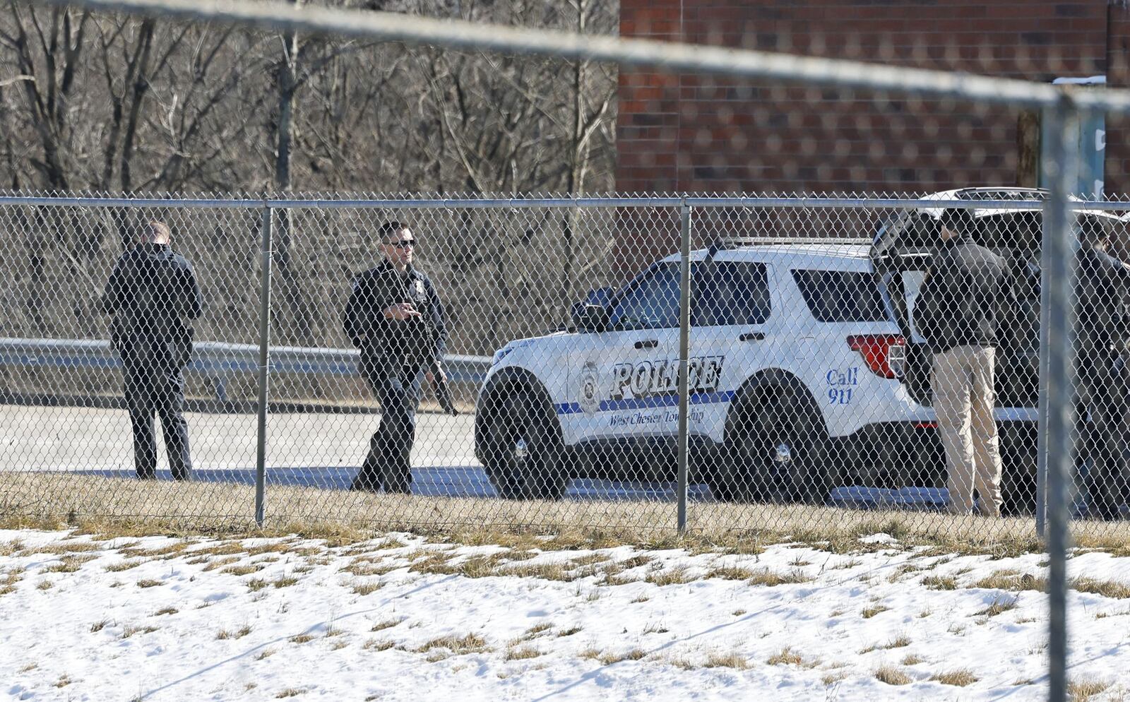 Police investigating at Walmart in West Chester Twp. Monday after a report of a male with a gun walking behind the building. Joshua Knowlton, 26, was charged with misdemeanor theft, intoxication after gun incident behind West Chester Walmart where he allegedly stole machete and Modelo, then fired rounds into the ground. NICK GRAHAM/STAFF