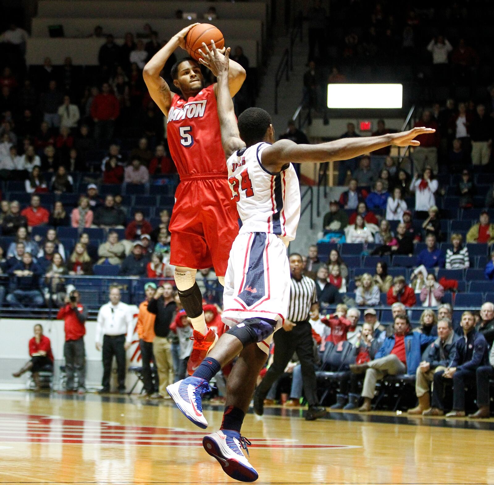 Devin Oliver makes the game-winning 3-pointer over Mississippi's Aaron Jones with 0.3 to play in overtime on Saturday, Jan. 4, 2014, in Oxford, Miss. David Jablonski/Staff