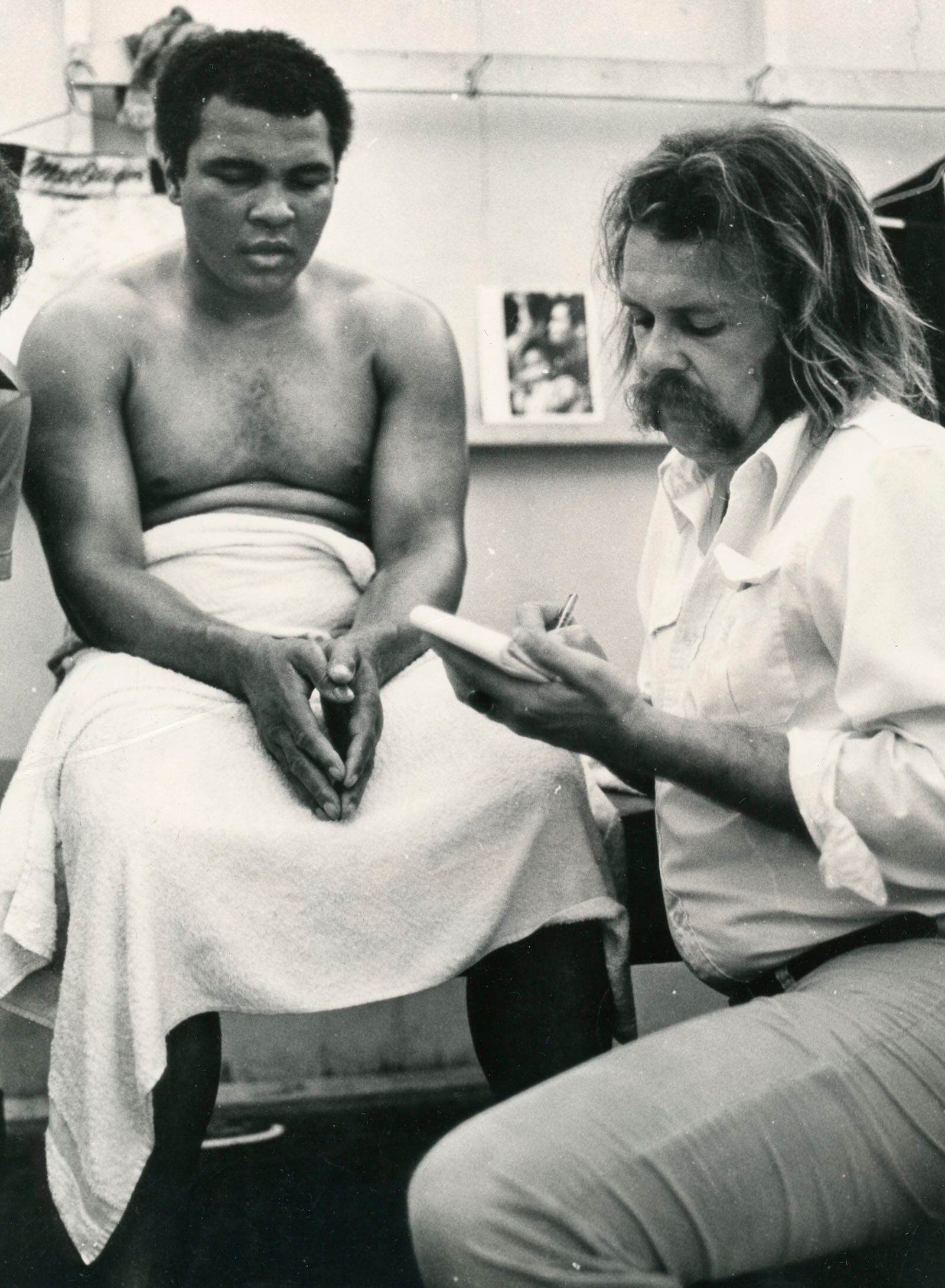 Muhammad Ali and Tom Archdeacon talk before Ali fought Larry Holmes in 1980.