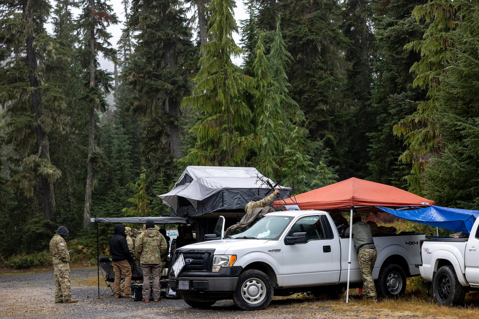 About 30 members of the U.S. Army's 1st Special Forces Group, Airborne Division meet for a search and rescue operation for the two missing Navy aviators on Friday, Oct. 18, 2024, near Goose Prairie, Yakima County, Wash. (Nick Wagner/The Seattle Times via AP)