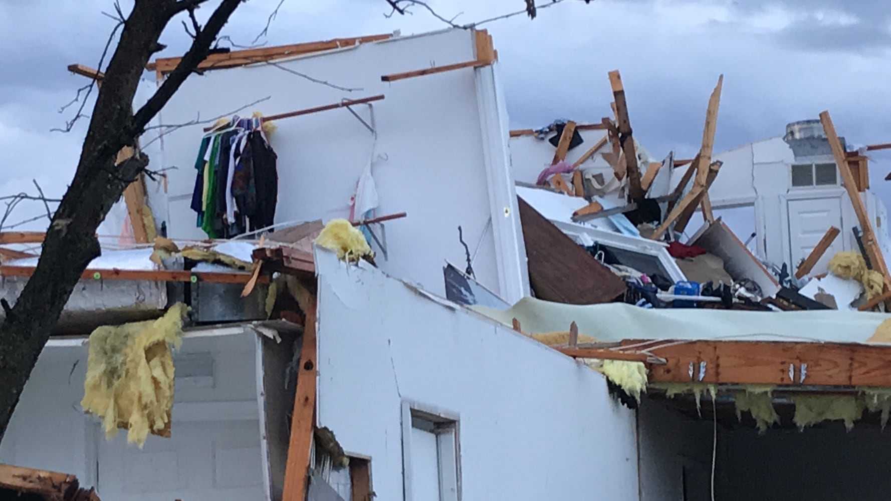 PHOTOS: Tornado-damaged communities dig out, clean up