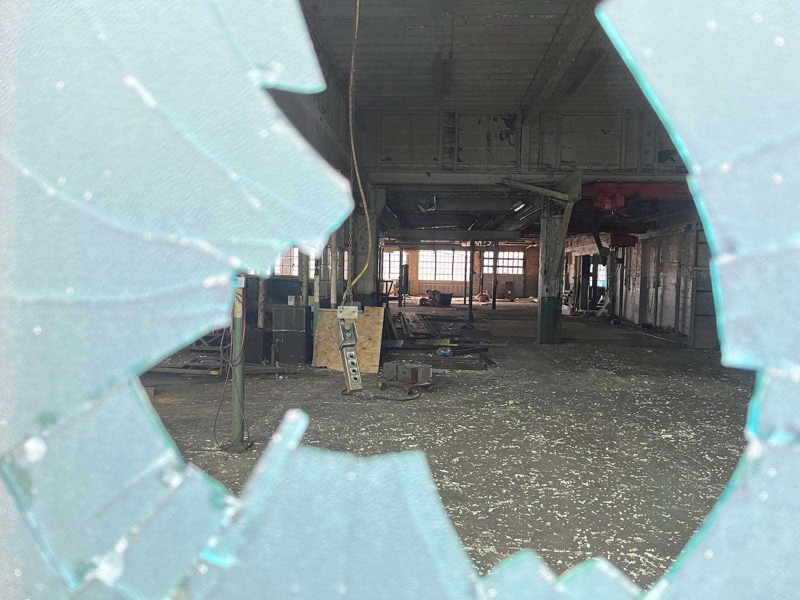 A peek inside the Midwest Tool & Engineering property on the 100 block of Webster Street through one of its broken windows. The owner, Windsor Companies, wants to demolish the property to make way for a new, four-story apartment building. The property is near the 2nd Street Market and Little Fish Brewing Co. CORNELIUS FROLIK / STAFF