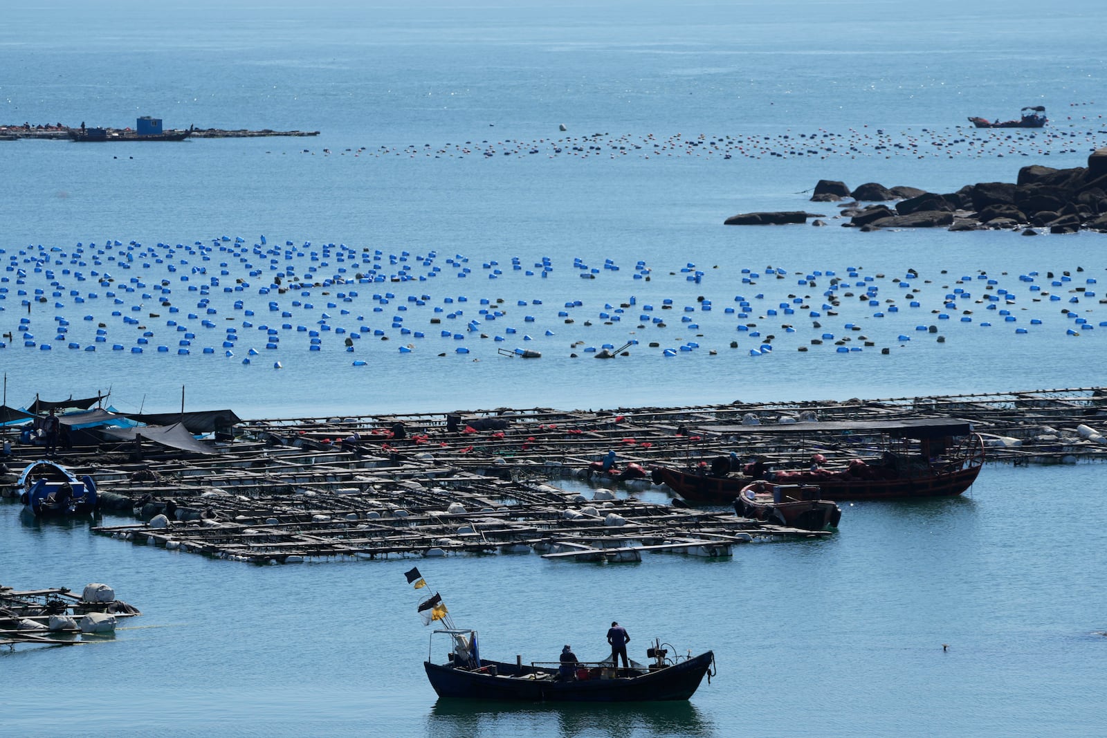 FILE - A boat moves through the water at the 68-nautical-mile scenic spot, the closest point in mainland China to the island of Taiwan, in Pingtan in southeastern China's Fujian Province, on Aug. 5, 2022. (AP Photo/Ng Han Guan, File)