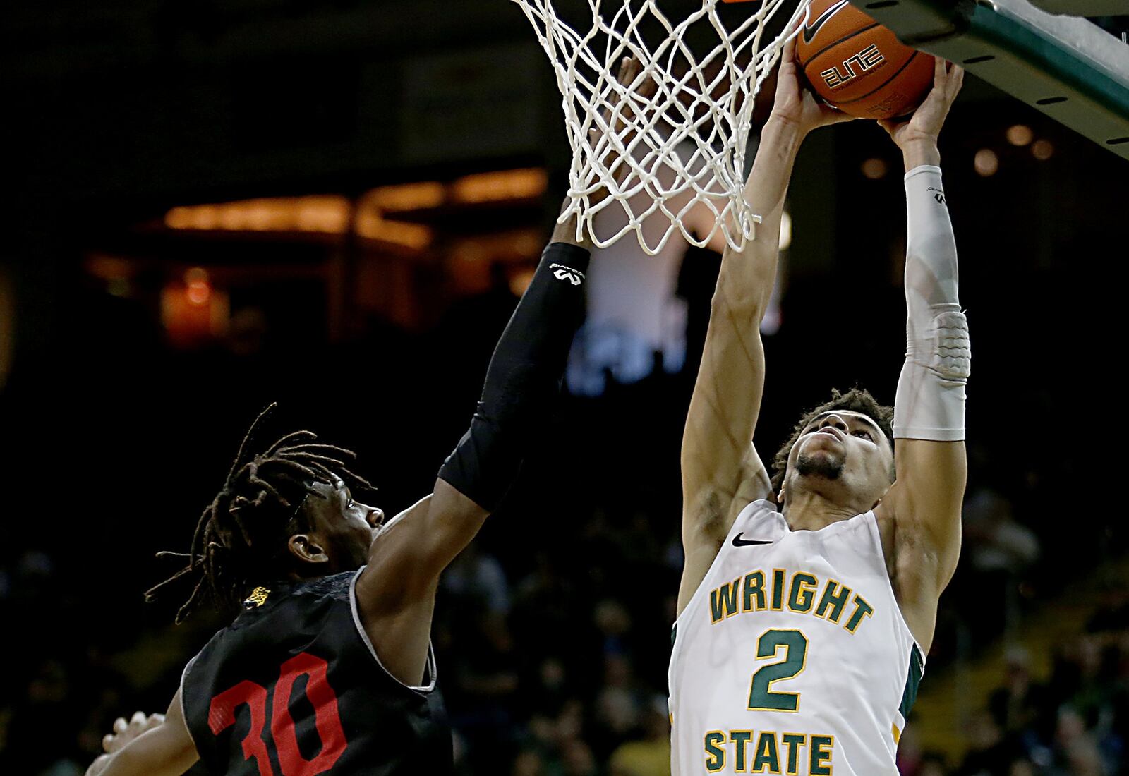 Wright State University guard Tanner Holden adds two against IUPUI forward Zo Tyson during their Horizon League game at the Nutter Center in Fairborn Sunday, Feb. 16, 2020. Wright State won 106-66. Contributed photo by E.L. Hubbard