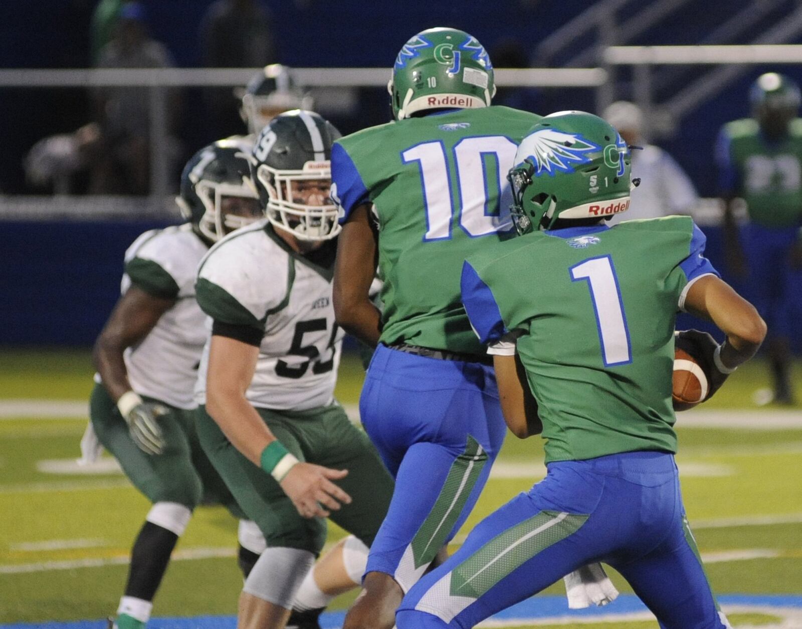 CJ quarterback Ryan Minor (1) and receiver Dominic Wilcox. Chaminade Julienne defeated visiting Greenville 58-16 in a Week 3 high school football game on Thursday, Sept. 6, 2018. MARC PENDLETON / STAFF