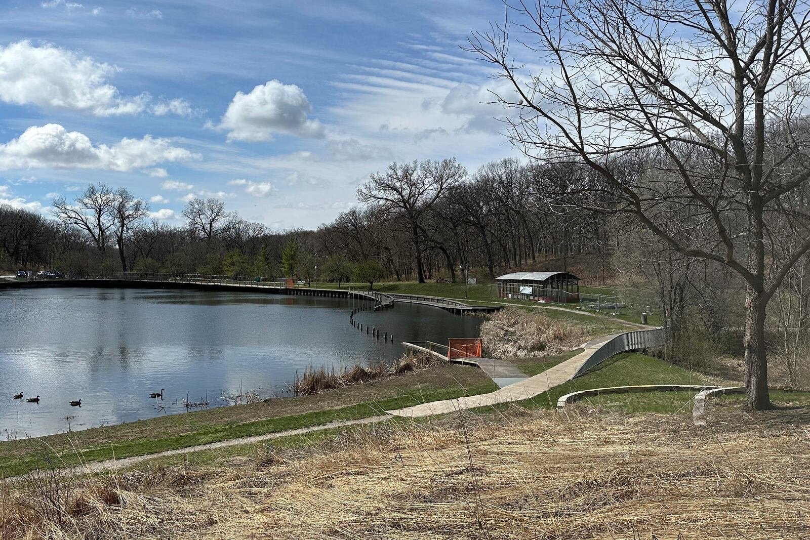 FILE - Part of the land artwork Greenwood Pond: Double Site, stands at Greenwood Pond in Des Moines, Iowa, April 3, 2024. (AP Photo/Scott McFetridge, File)