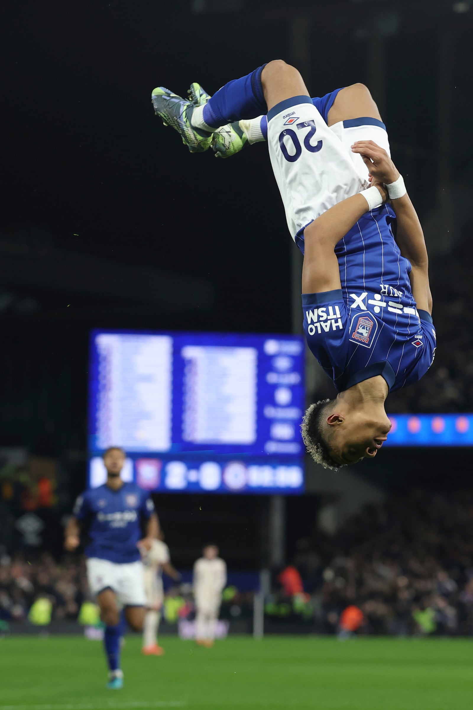 Ipswich Town's Omari Hutchinson does a back flip as he celebrates after scoring his side second goal during the English Premier League soccer match between Ipswich Town and Chelsea at Portman Road stadium in Ipswich, England, Monday, Dec. 30, 2024. (AP Photo/Richard Pelham)