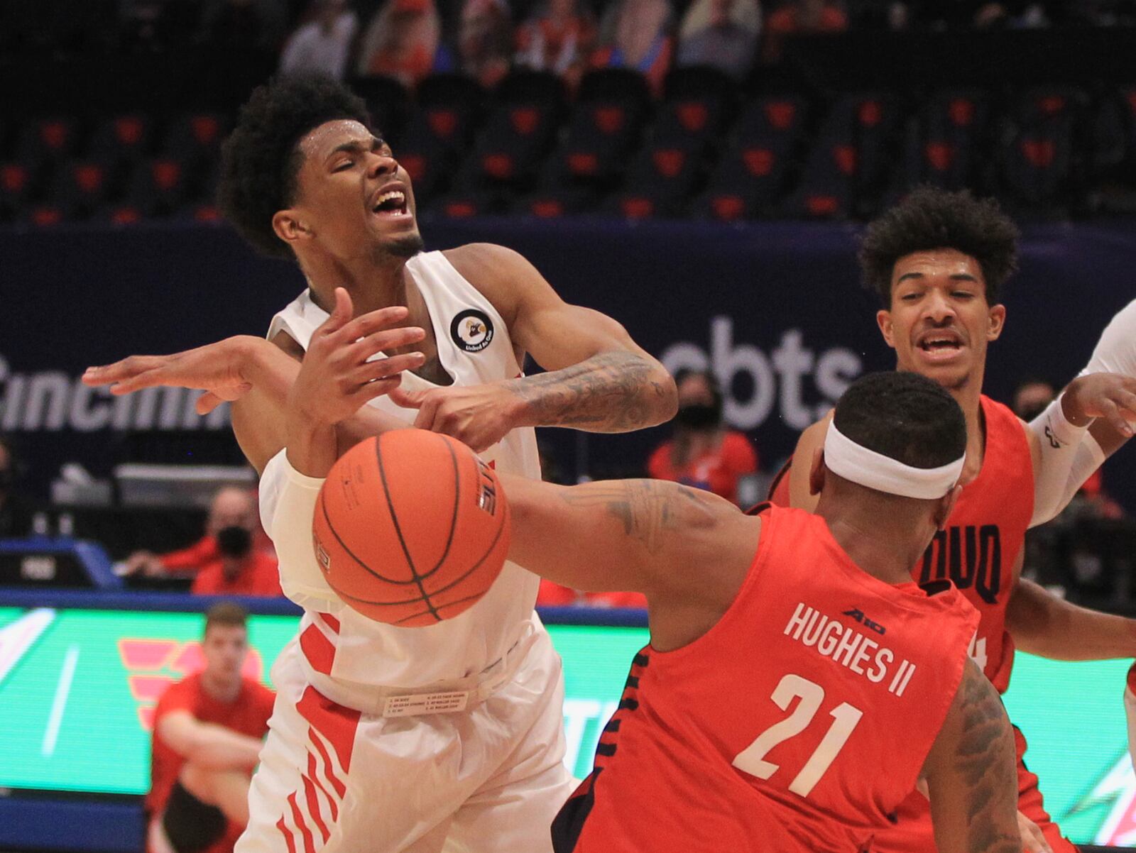 Dayton's Elijah Weaver is fouled by Duquesne on Wednesday, Jan. 13, 2021, at UD Arena. David Jablonski/Staff